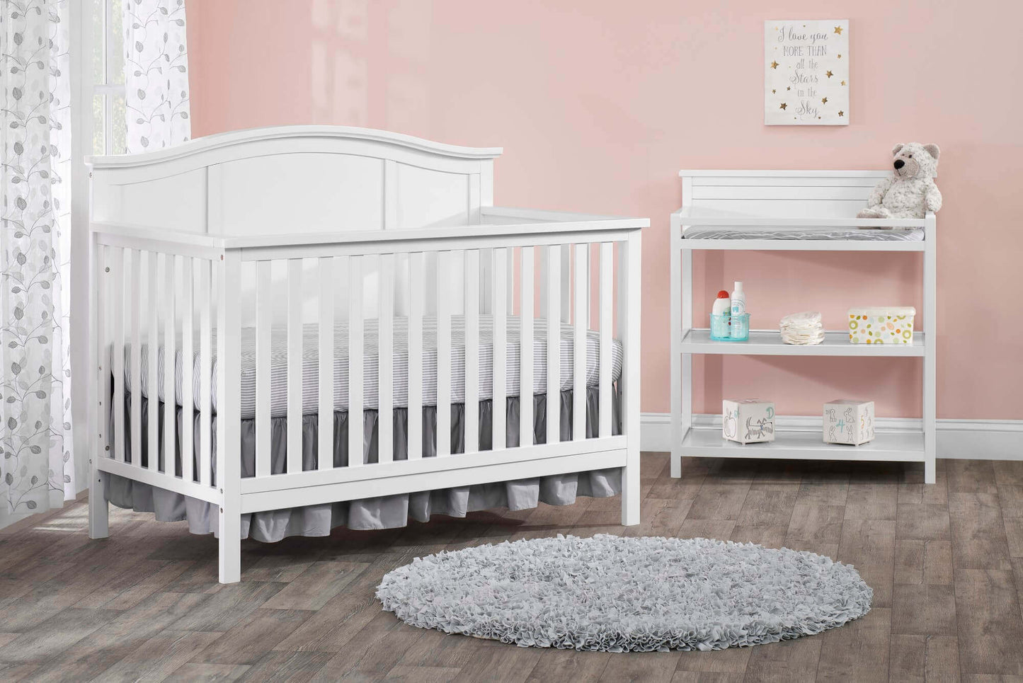 Emerson 4-in-1 Convertible Crib - Lifestyle Image Inclined Side View of Emerson 4-in-1 Convertible Crib Snow White