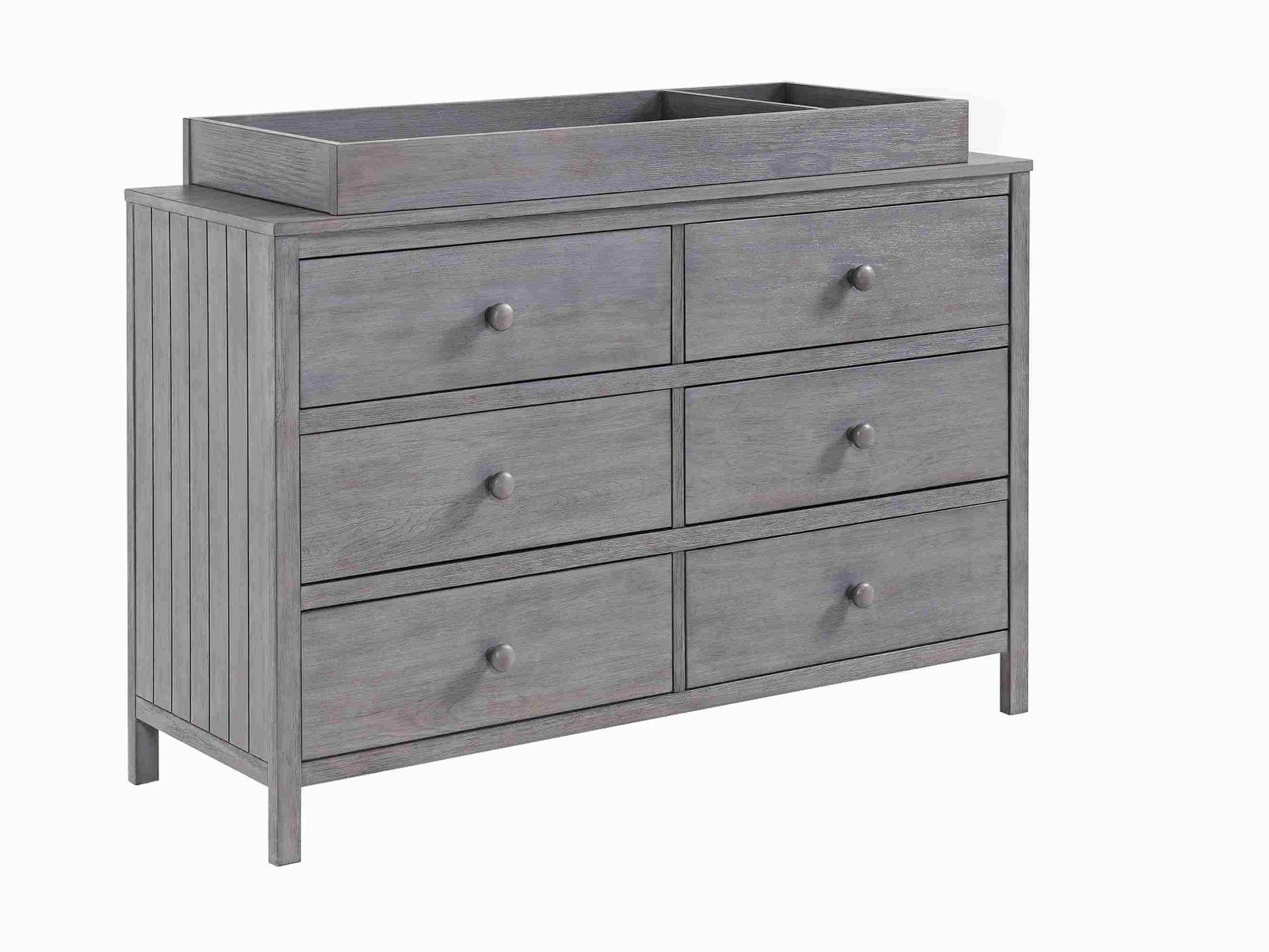 Everlee Changing Topper - Inclined Side View of Everlee Changing Topper on Top of 6 Drawer Dresser Gray