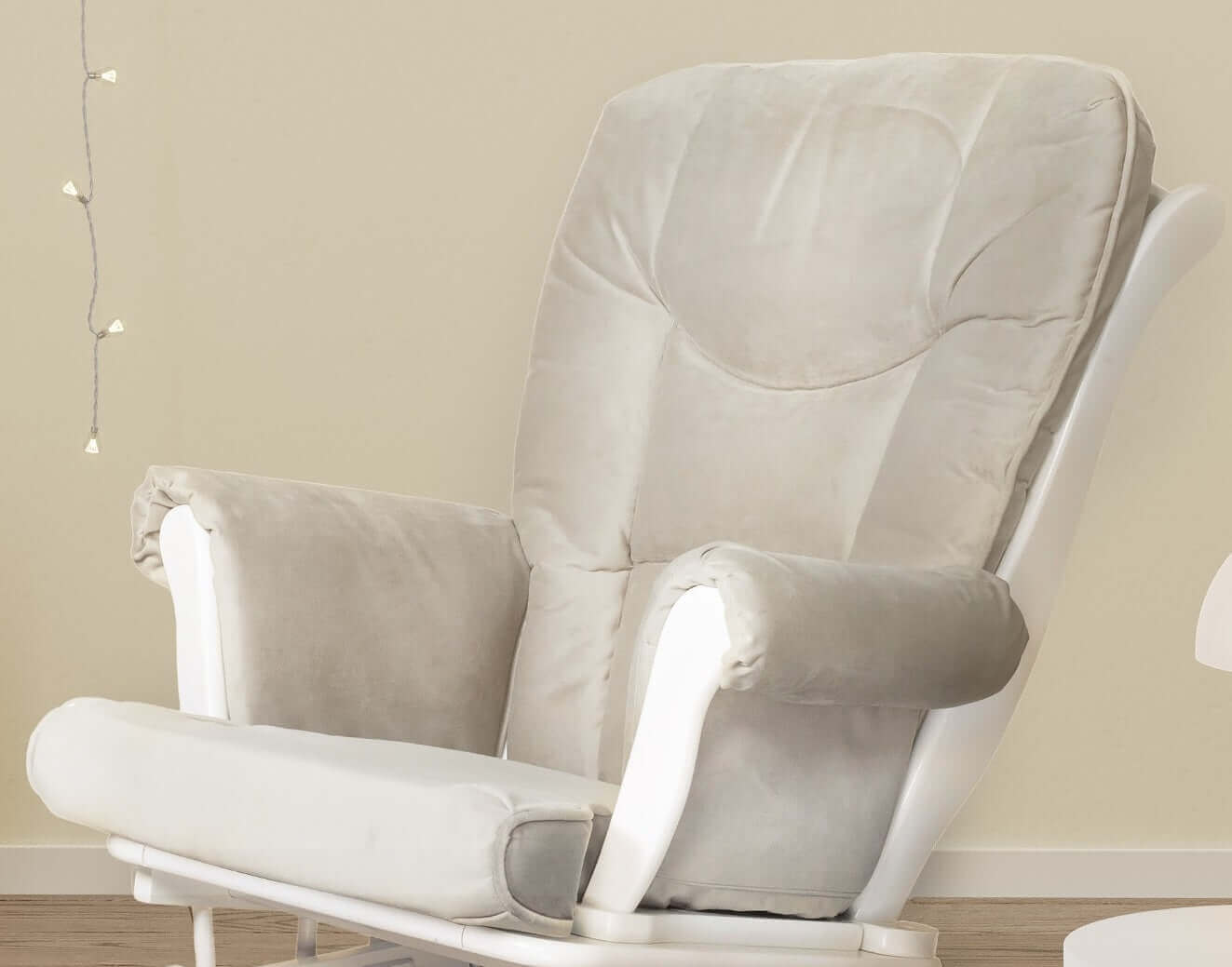 Sleigh Glider Chair Cushions Set - Lifestyle Image Inclined Side View of the Glider Chair Cushions Set Gray