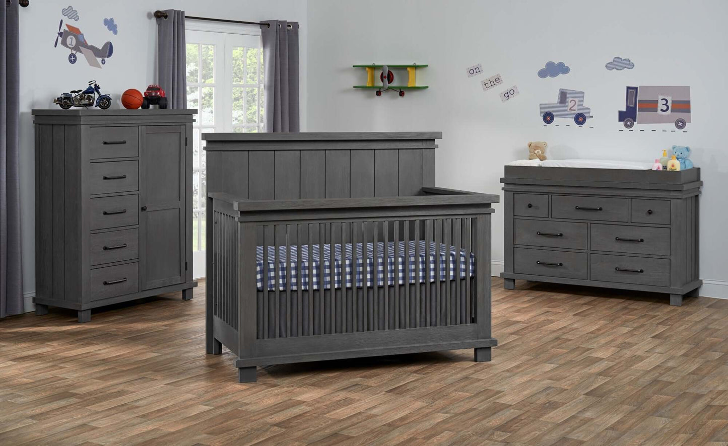 Hampton Changing Topper - Lifestyle Image Inclined Side View of Hampton Changing Topper on Top of Chifferobe Canyon Gray