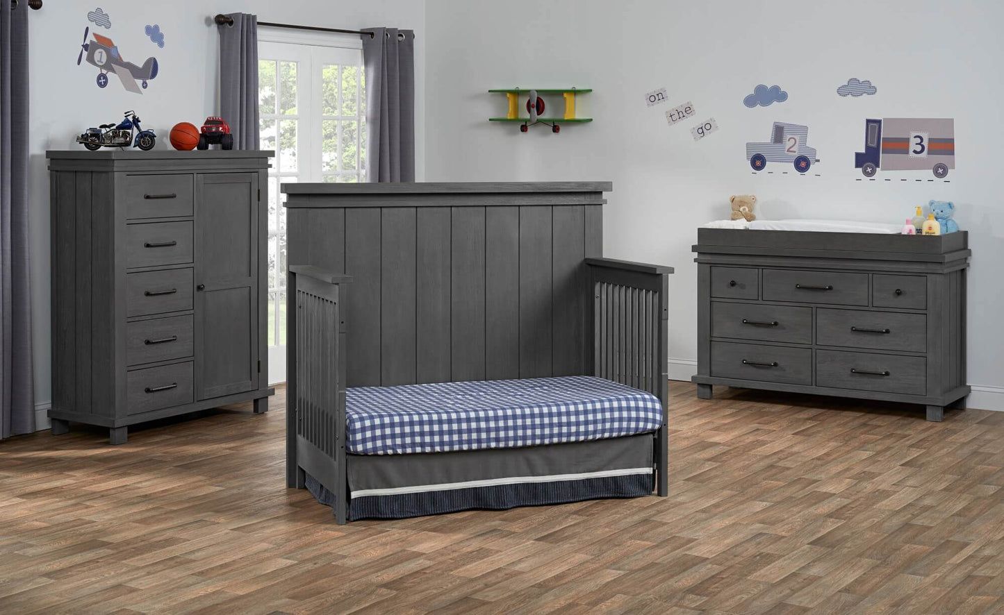 Hampton 4 In 1 Convertible Crib - Lifestyle Image Inclined Side View of Hampton Daybed Canyon Gray