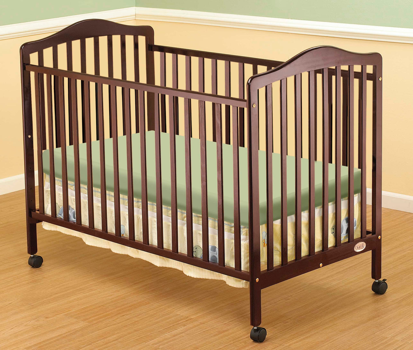 Jenny Full Size Crib - Lifestyle Image Inclined Side View of Jenny Full Size Crib Cherry