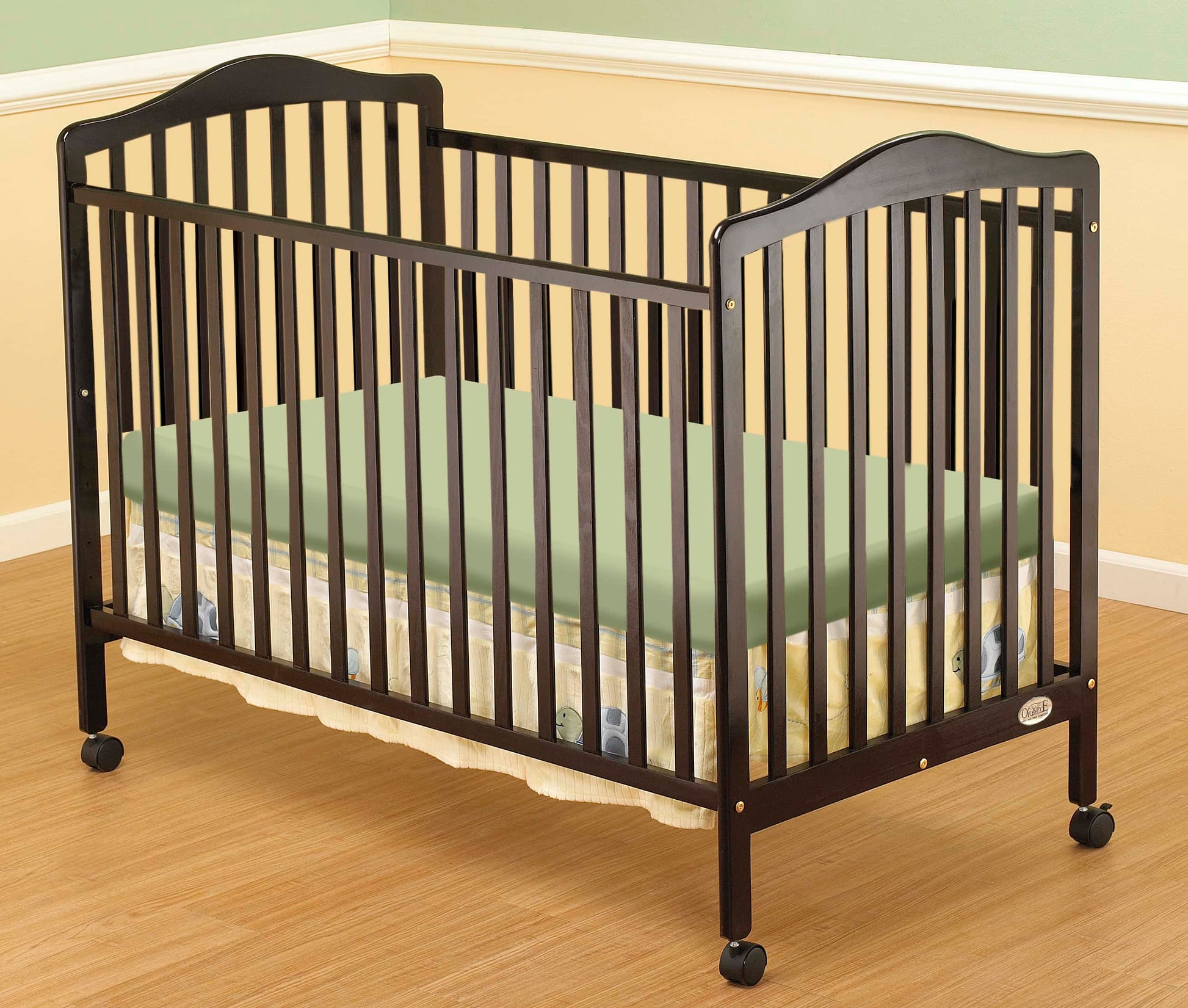 Jenny Full Size Crib - Lifestyle Image Inclined Side View of Jenny Full Size Crib Multi Tone Gray