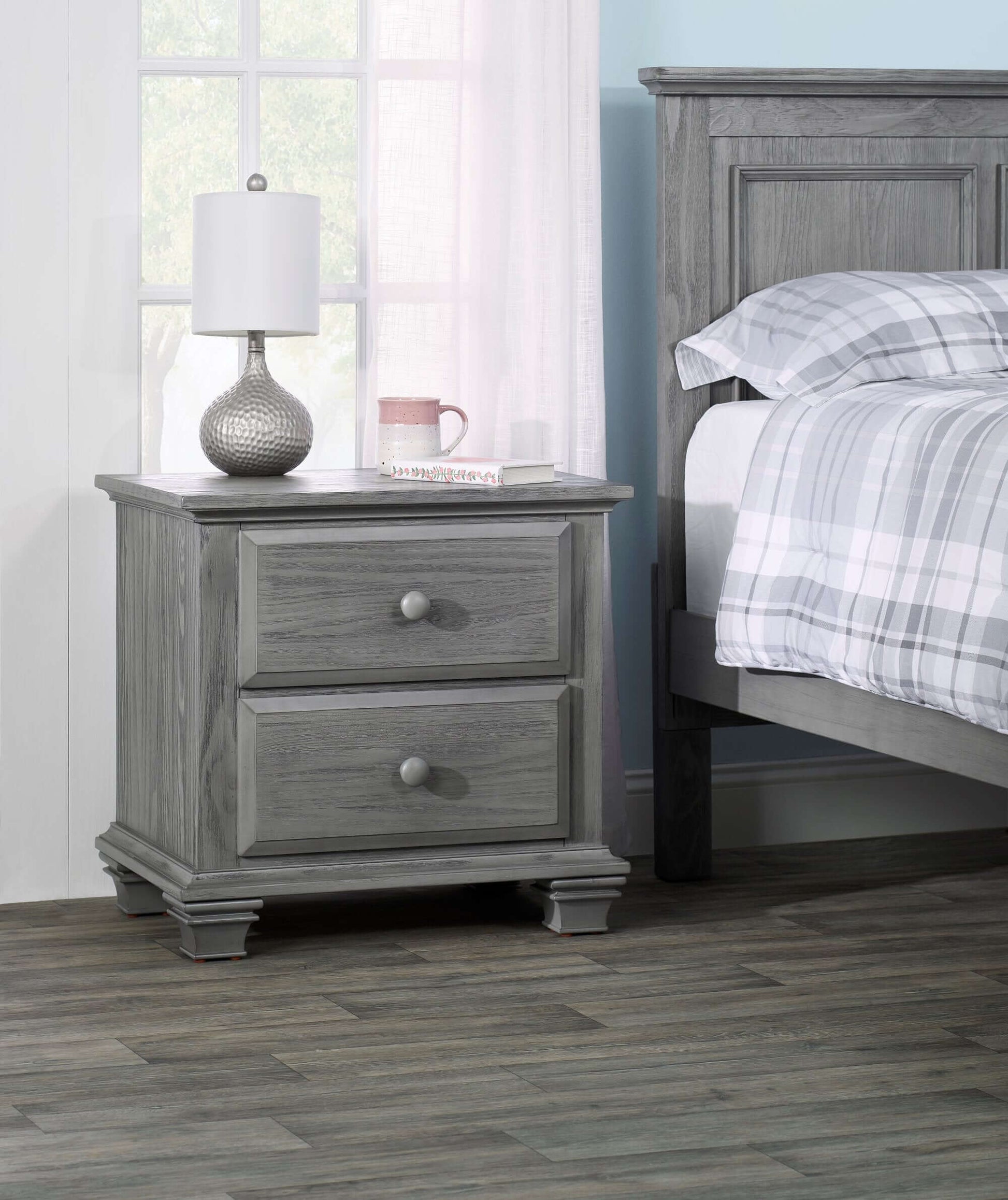 Kenilworth 2-Drawer Nightstand - Lifestyle Image Inclined Side View of Kenilworth 2-Drawer Nightstand Graphite Gray