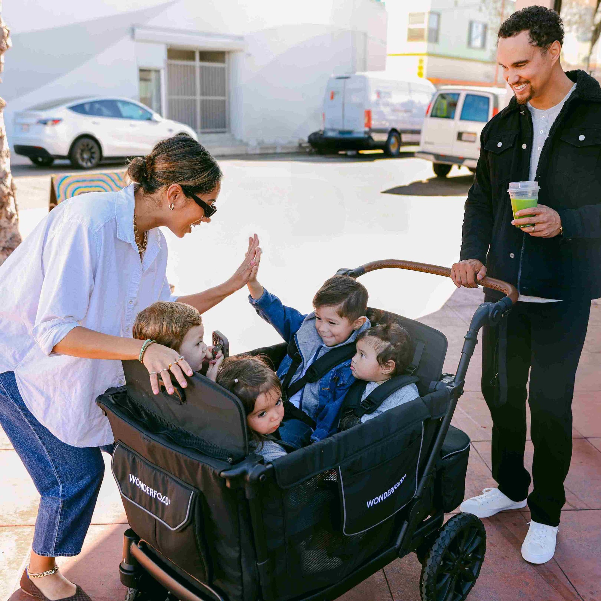 L4 Quad Stroller Wagon - Lifestyle Image of Family with Children's on L4 Quad Stroller Wagon Black With Handle