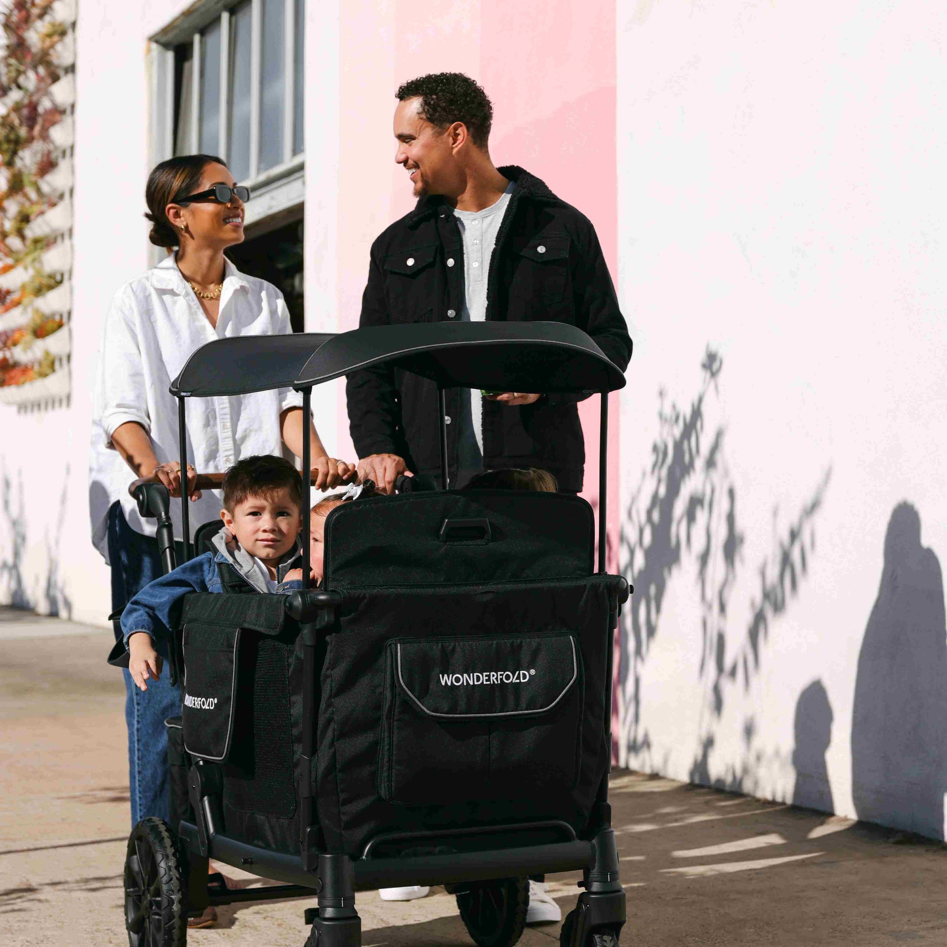 L4 Quad Stroller Wagon - Lifestyle Image of Family with Children's on L4 Quad Stroller Wagon Black With Handle-1