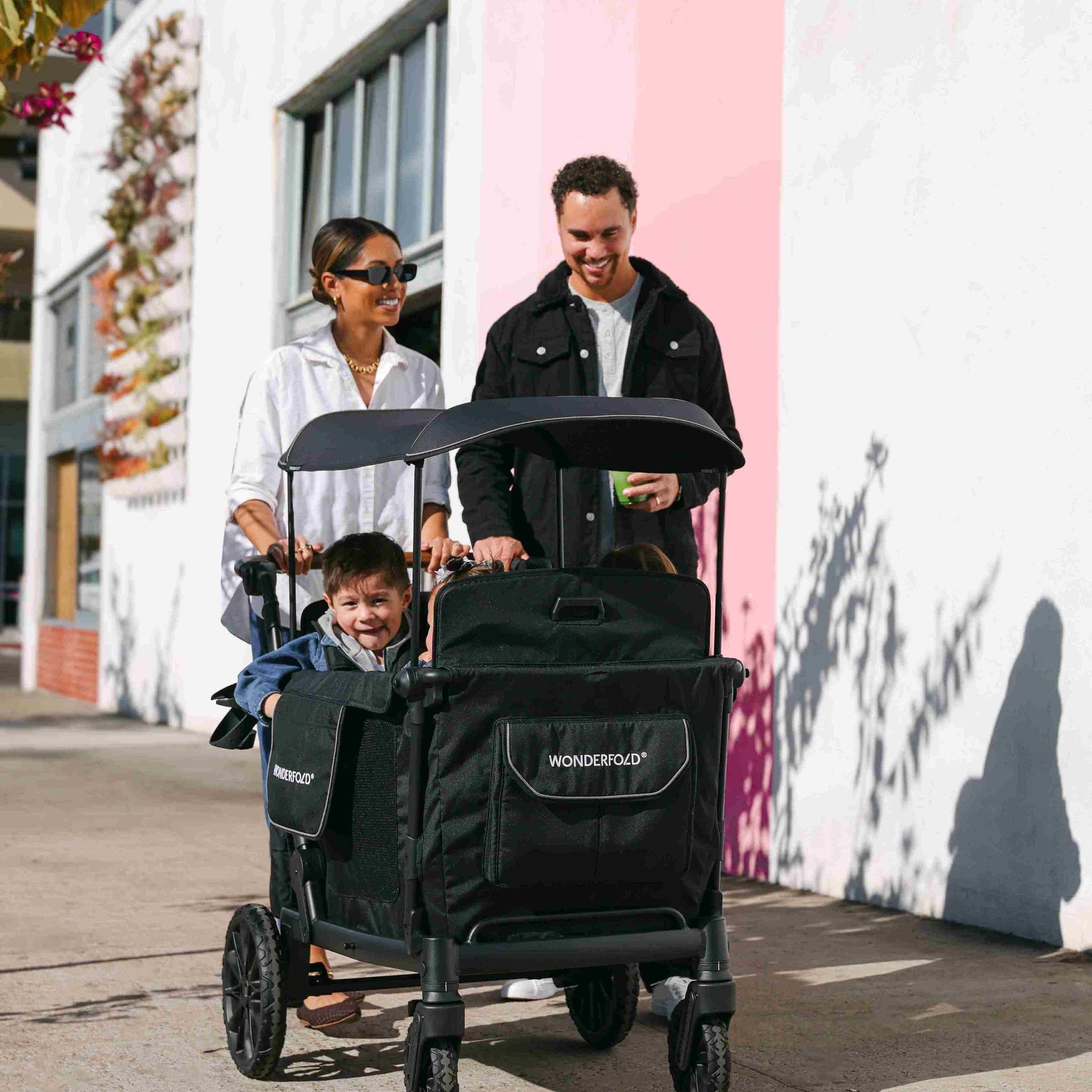 L4 Quad Stroller Wagon - Lifestyle Image of Family with Children's on L4 Quad Stroller Wagon Black With Handle-2