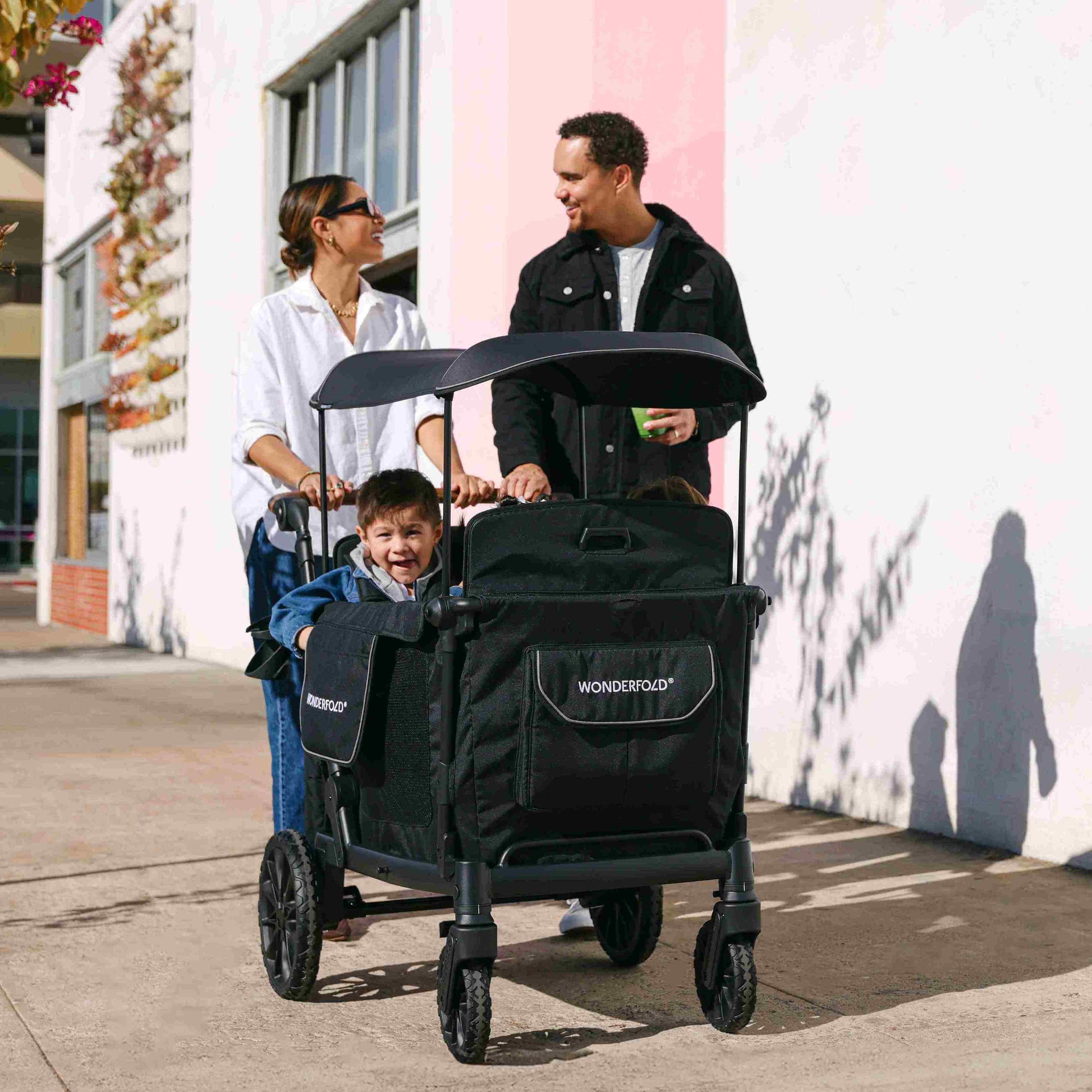 L4 Quad Stroller Wagon - Lifestyle Image of Family with Children's on L4 Quad Stroller Wagon Black With Handle-3