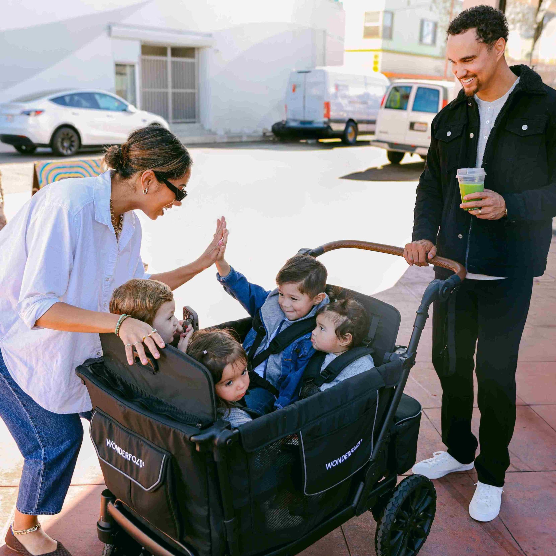 L4 Quad Stroller Wagon - Lifestyle Image of Family Enjoying With Children's on L4 Quad Stroller Wagon Gray-1