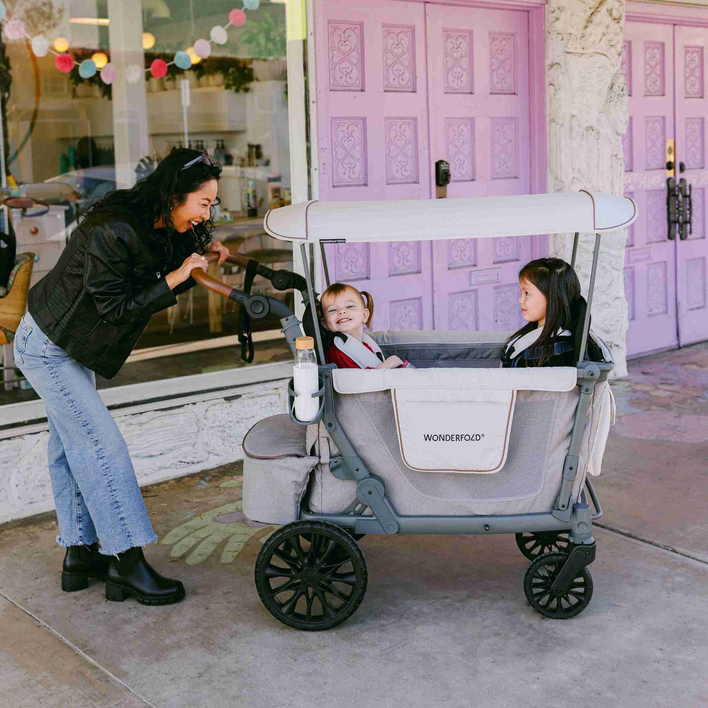 L4 Quad Stroller Wagon - Lifestyle Image of Mother With 2 daughter's on L4 Quad Stroller Wagon Gray