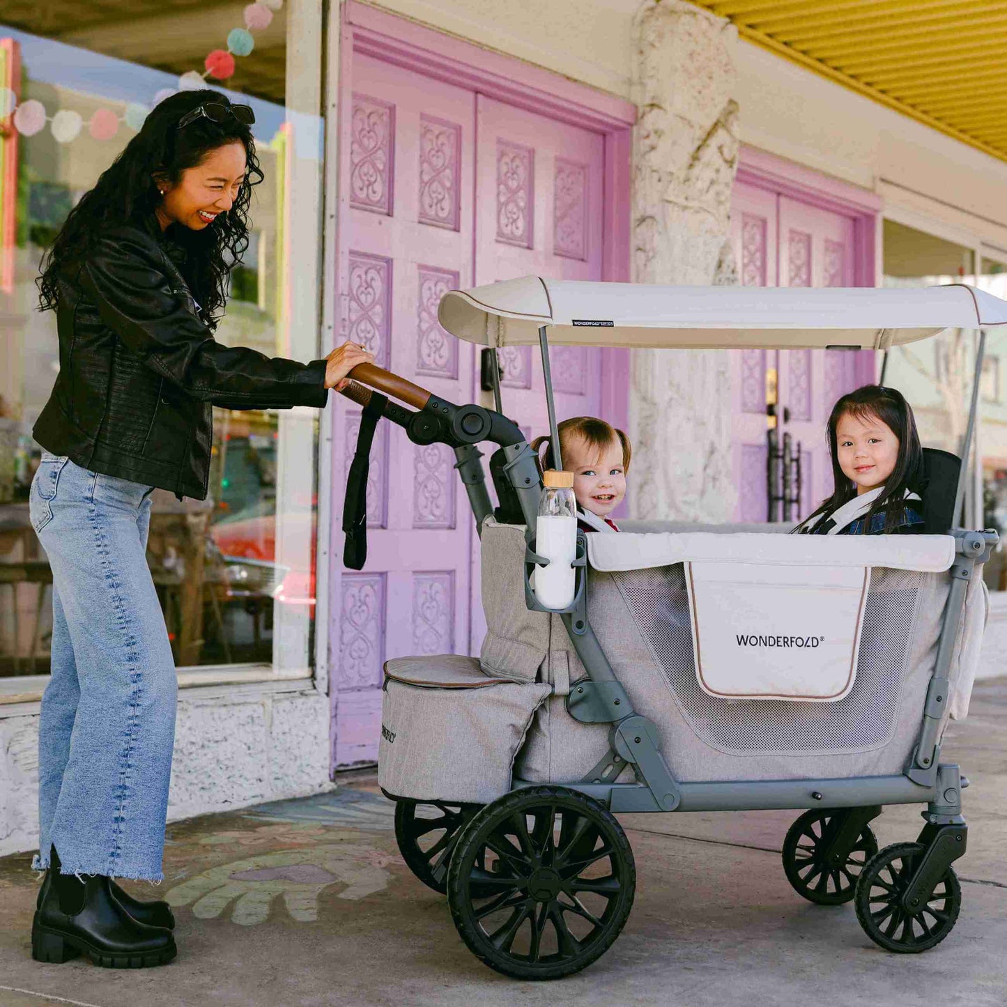 L4 Quad Stroller Wagon - Lifestyle Image of Mother With 2 daughter's on L4 Quad Stroller Wagon Gray