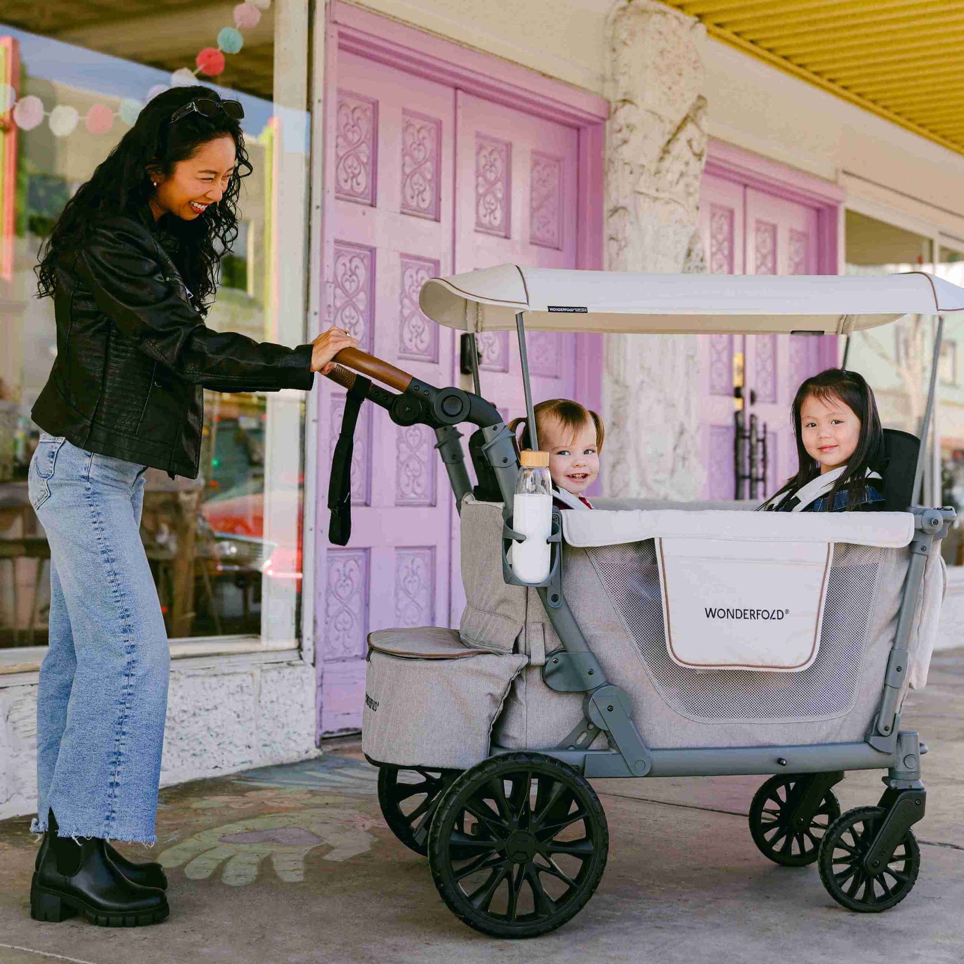 L4 Quad Stroller Wagon - Lifestyle Image of Mother With 2 daughter's on L4 Quad Stroller Wagon Gray
