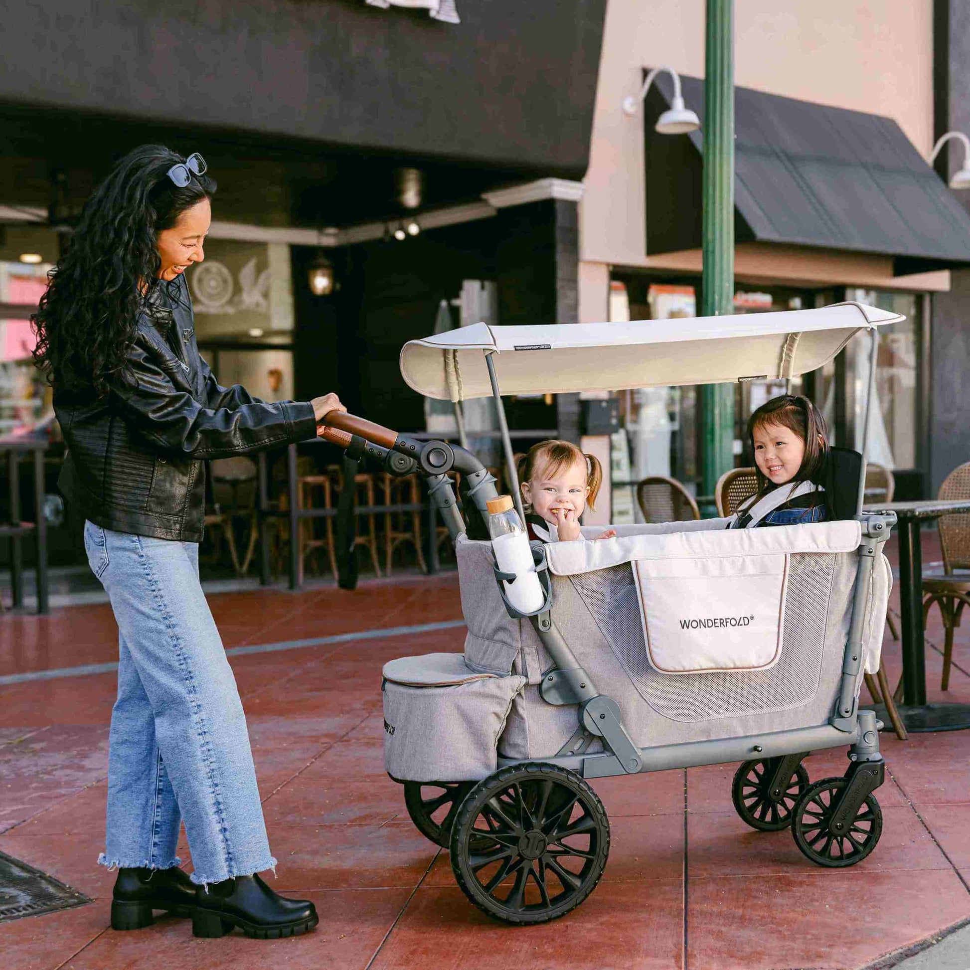 L4 Quad Stroller Wagon - Lifestyle Image of Mother With 2 daughter's on L4 Quad Stroller Wagon Gray