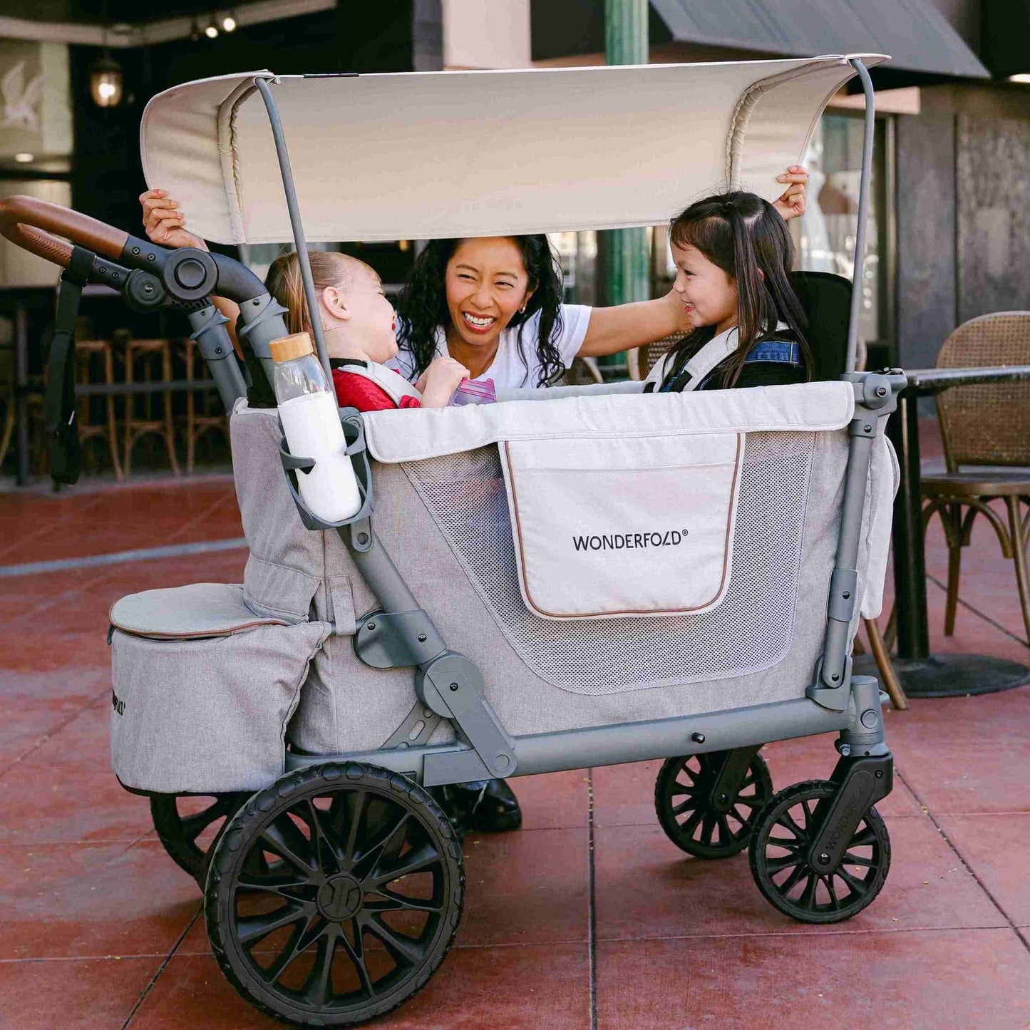 L4 Quad Stroller Wagon - Lifestyle Image of Mother With 2 daughter's on L4 Quad Stroller Wagon Gray-1