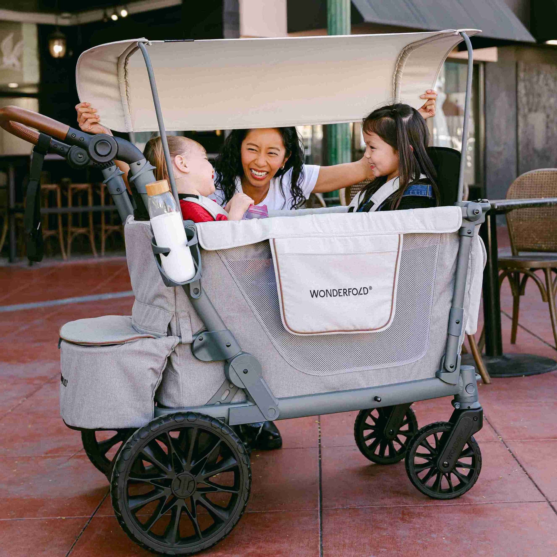 L4 Quad Stroller Wagon - Lifestyle Image of Mother With 2 daughter's on L4 Quad Stroller Wagon Gray-1