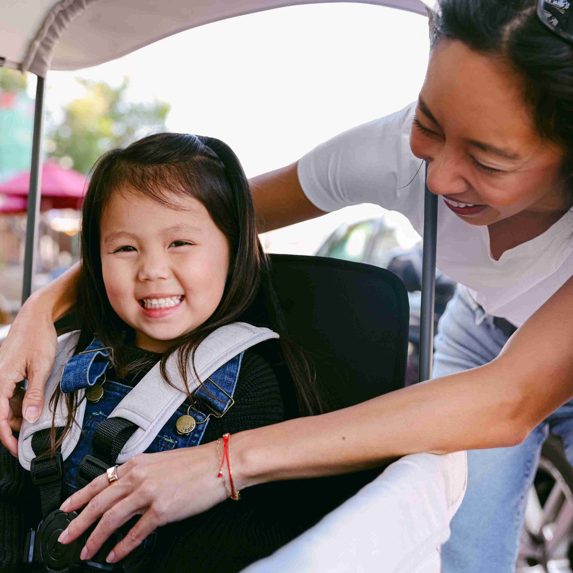 L4 Quad Stroller Wagon - Zoomed Lifestyle Image of Mother With daughter on L4 Quad Stroller Wagon Gray