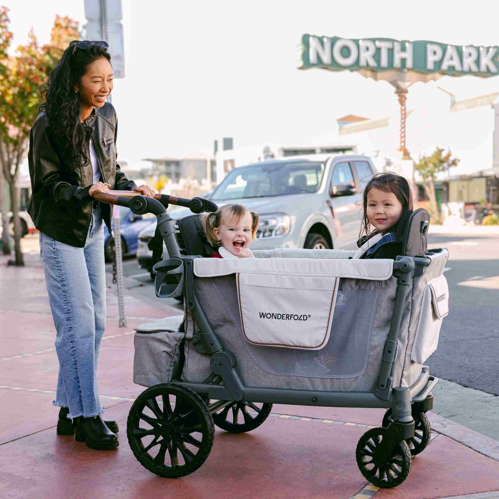 L4 Quad Stroller Wagon - Lifestyle Image of Mother With 2 daughter's on L4 Quad Stroller Wagon Gray-2