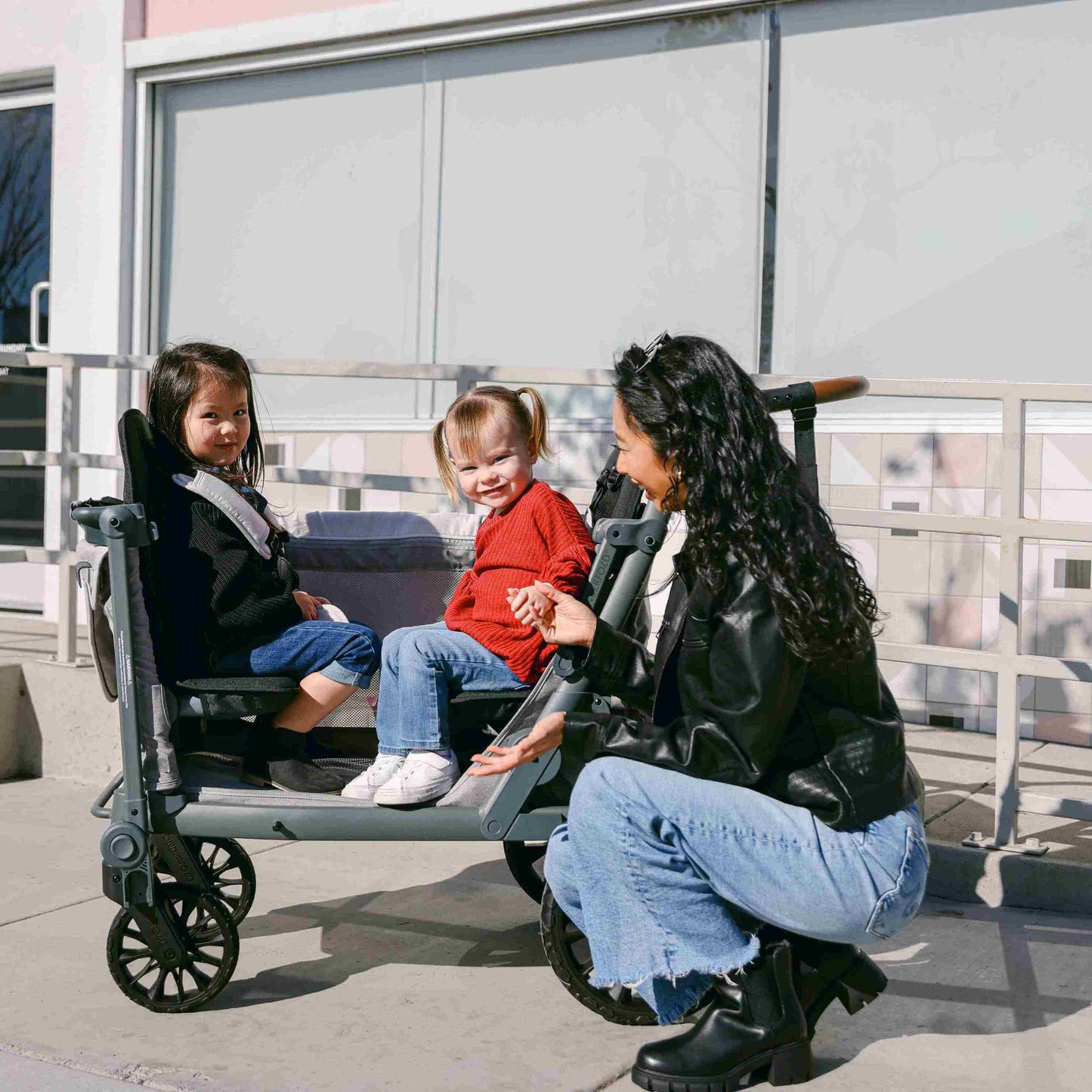 L4 Quad Stroller Wagon - Lifestyle Image Mother Helping Child to Get Out of L4 Quad Stroller Wagon