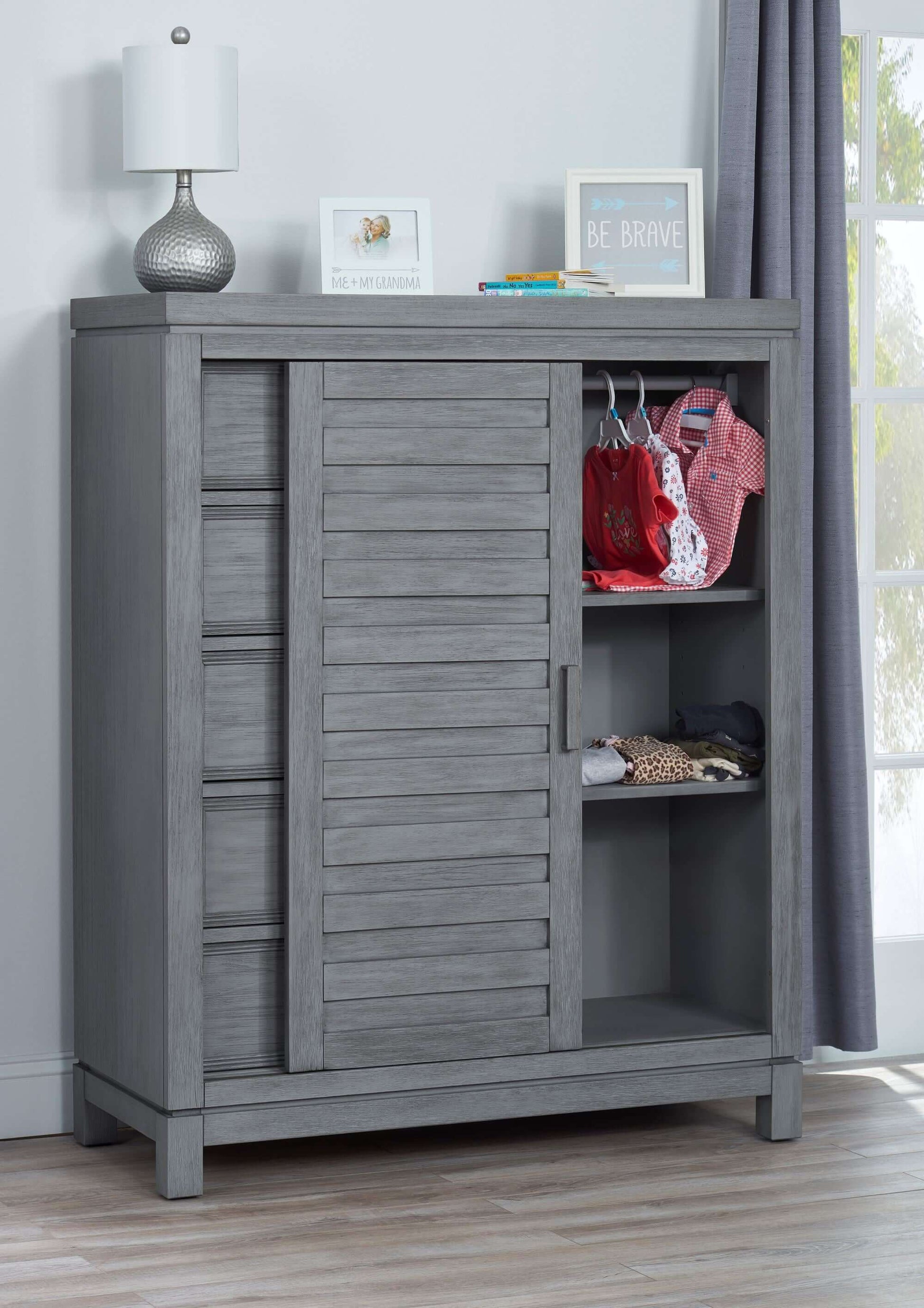Manchester Chifferobe w - Lifestyle Image Inclined Side View of Open Sliding door Manchester Chifferobe Rustic Gray