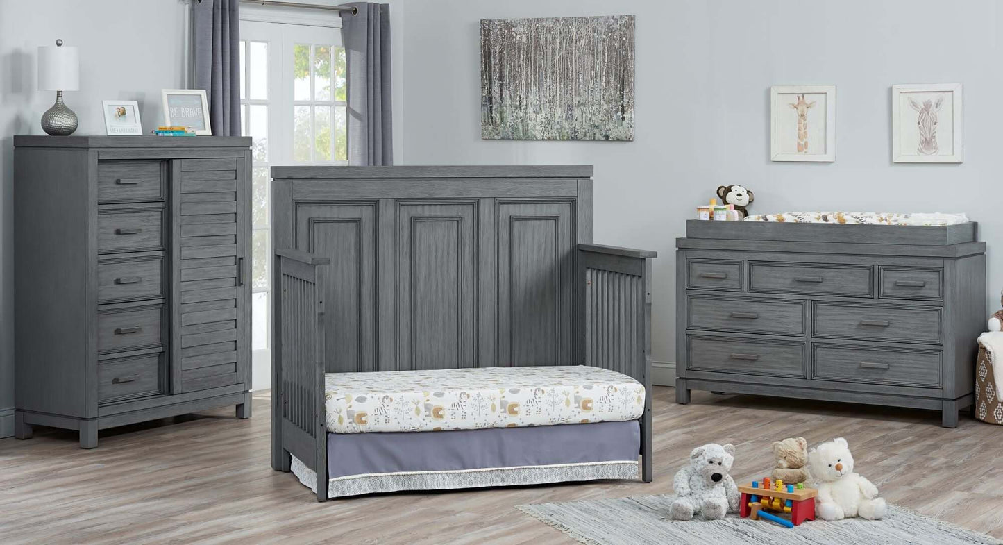 Manchester 4 In 1 Convertible Crib - Lifestyle Image Inclined Side View of Manchester Daybed Rustic Gray