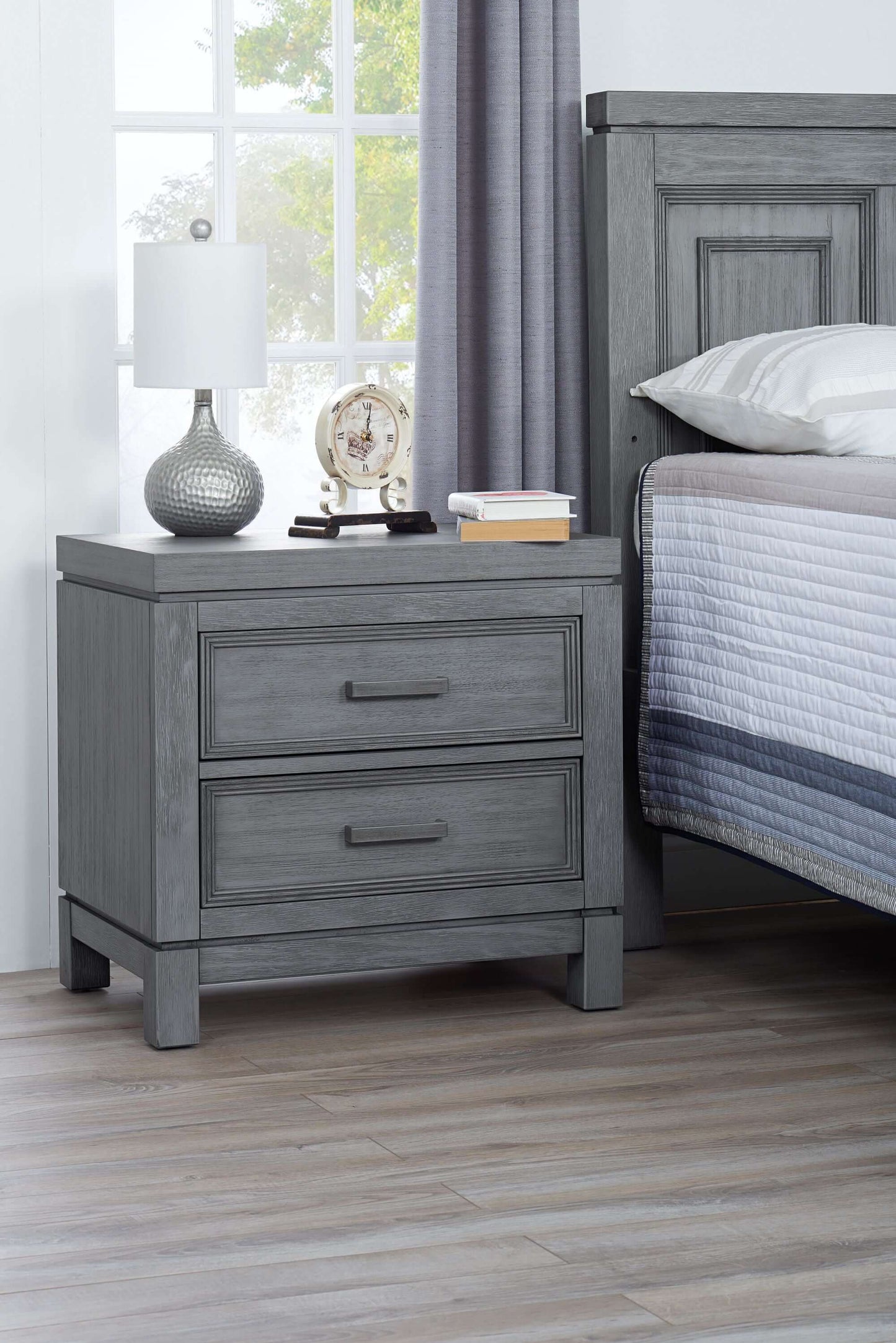 Manchester 2 Drawer Night Stand - Lifestyle Image Inclined Side View of Manchester 2 Drawer Night Stand Rustic Gray