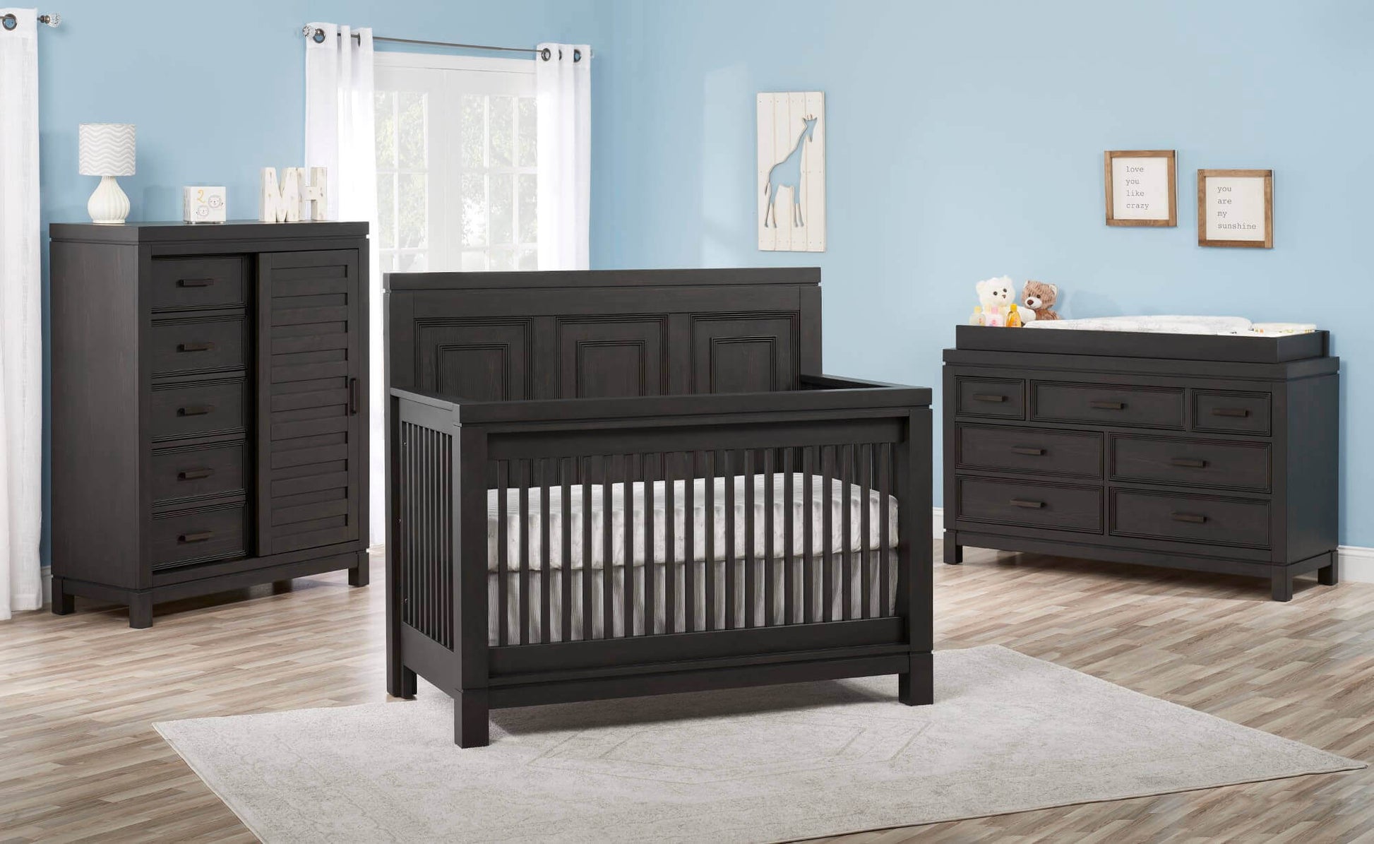 Manchester 4 In 1 Convertible Crib - Lifestyle Image Inclined Side View of Manchester 4 In 1 Convertible Crib Black Iron