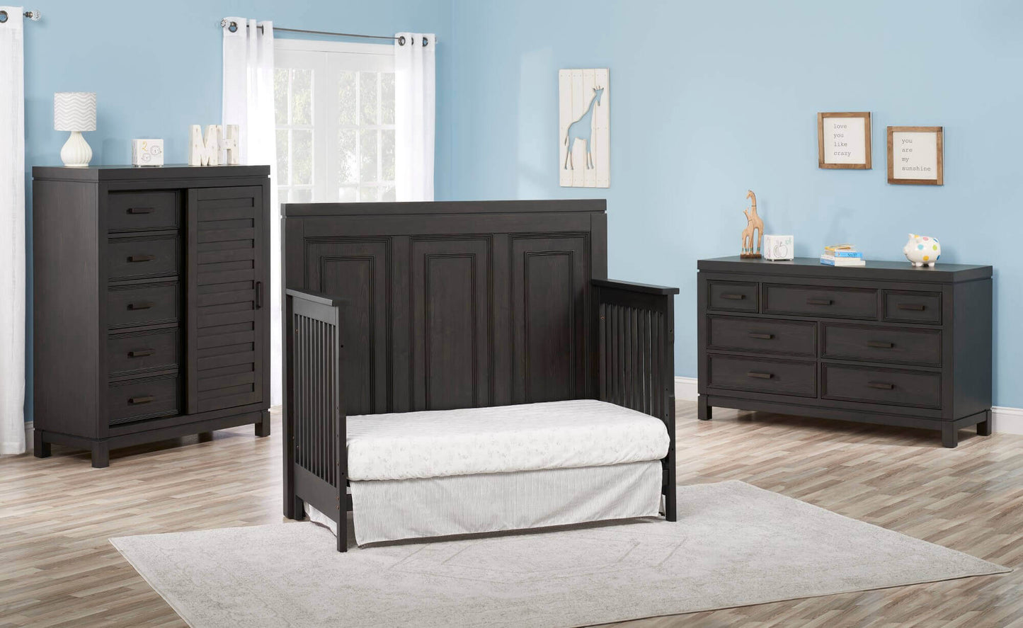 Manchester 4 In 1 Convertible Crib - Lifestyle Image Inclined Side View of Manchester Daybed Black Iron