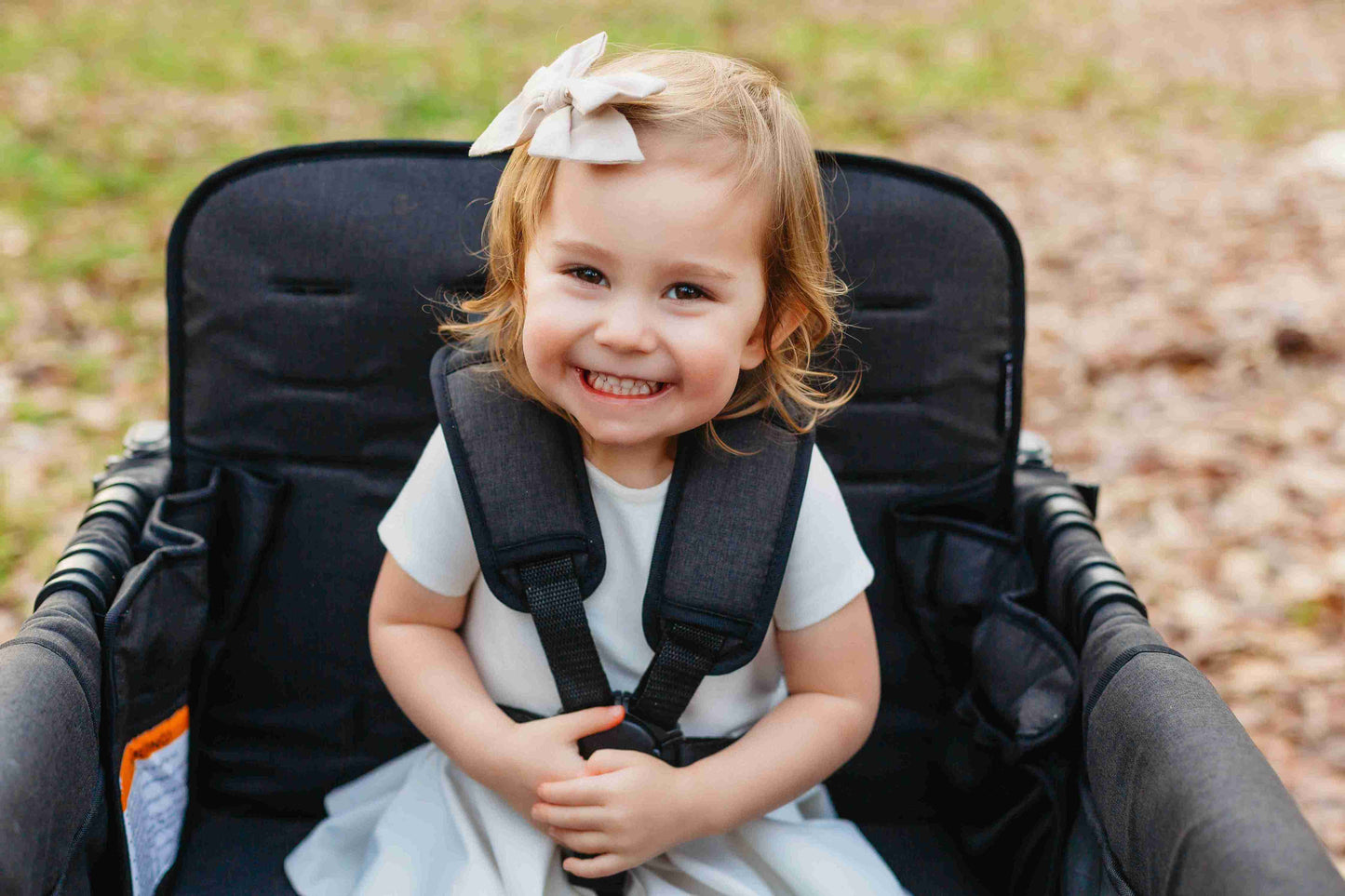 W4 Luxe Quad Stroller Wagon - Zoomed Lifestyle Image of Toddler on W4 Luxe Quad Stroller Wagon Black Camo