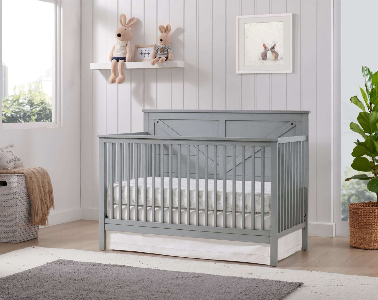 Montauk 4-in-1 Convertible Crib - Lifestyle Image Inclined Side View of Montauk 4-in-1 Convertible Crib Farmhouse Gray