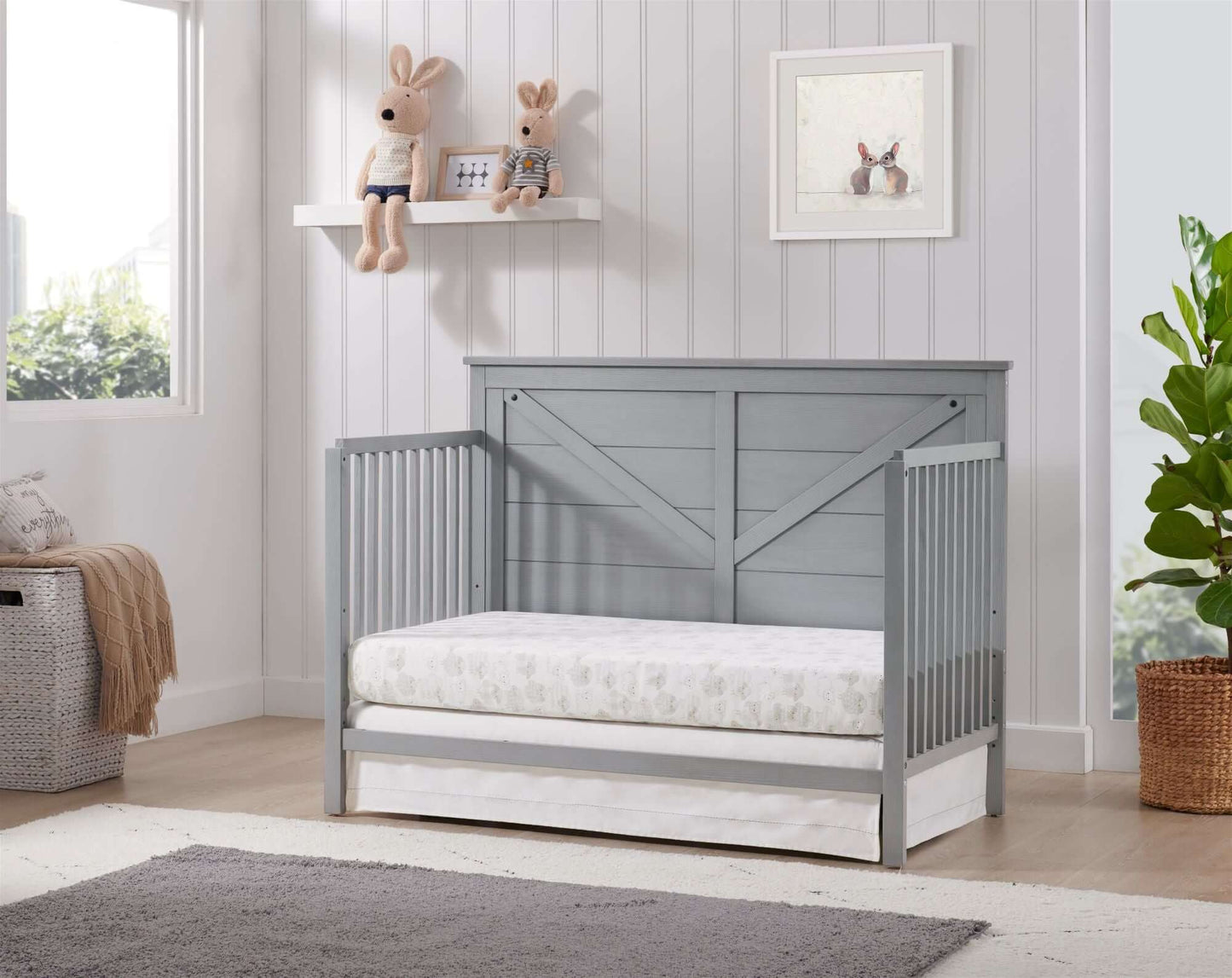 Montauk 4-in-1 Convertible Crib - Lifestyle Image Inclined Side View of Montauk Daybed Farmhouse Gray