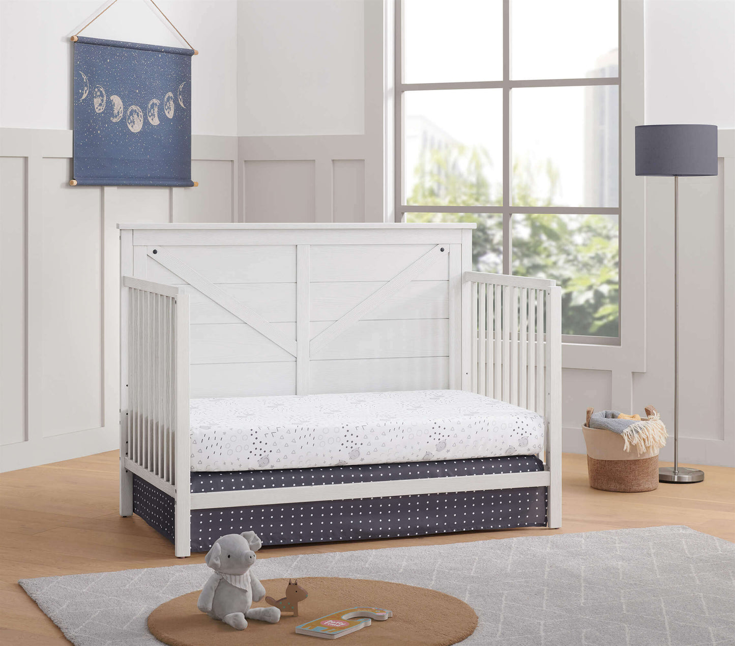 Montauk 4-in-1 Convertible Crib - Lifestyle Image Inclined Side View of Montauk Daybed Barn White