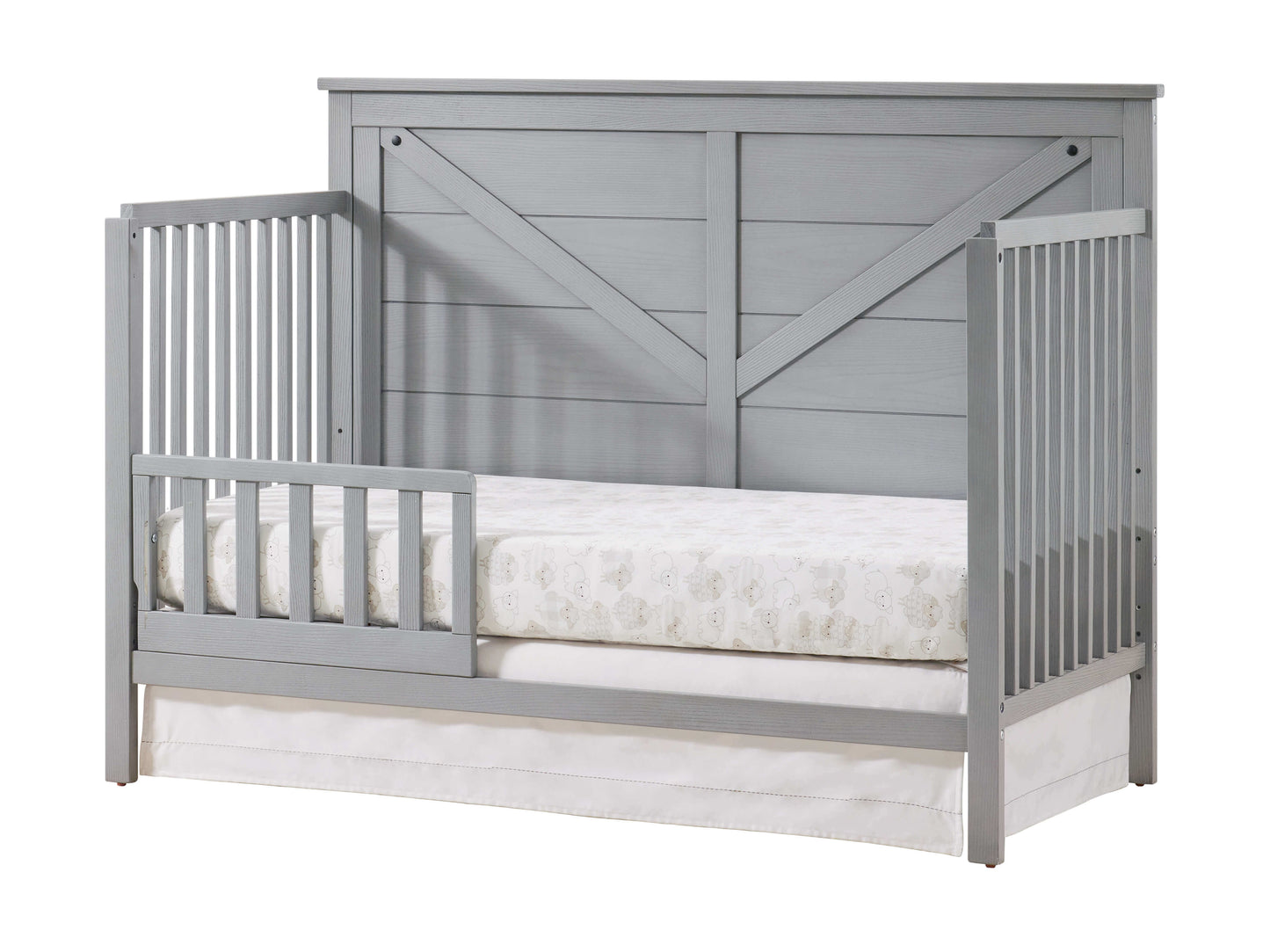 Montauk 4-in-1 Convertible Crib - Inclined Side View of Montauk 4-in-1 Convertible Crib Farmhouse Gray with Guard Rail