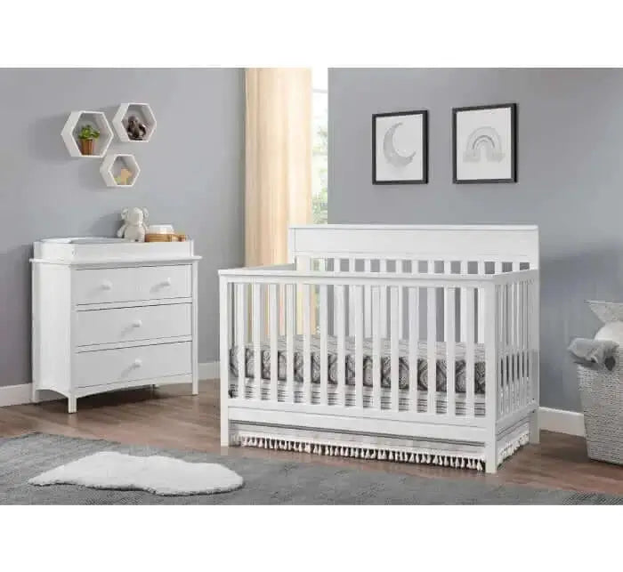 Castle Hill 4-in-1 Convertible Crib - Lifestyle Image Inclined Side View of Castle Hill 4-in-1 Convertible Crib Barn White