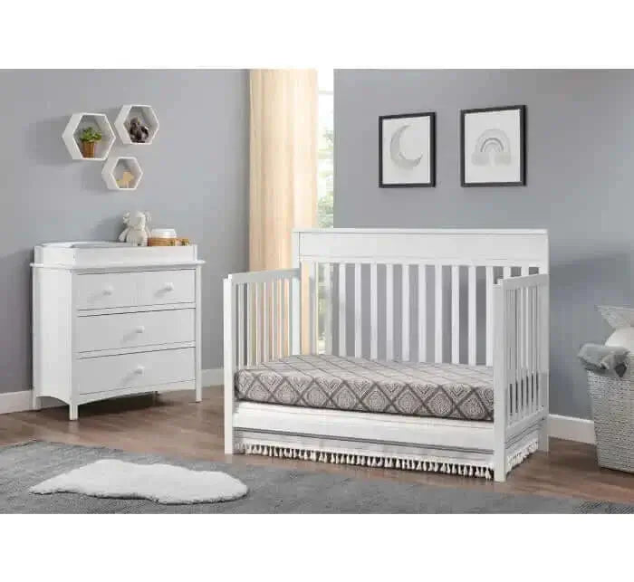 Castle Hill 4-in-1 Convertible Crib - Lifestyle Image Inclined Side View of Castle Hill Daybed Barn White