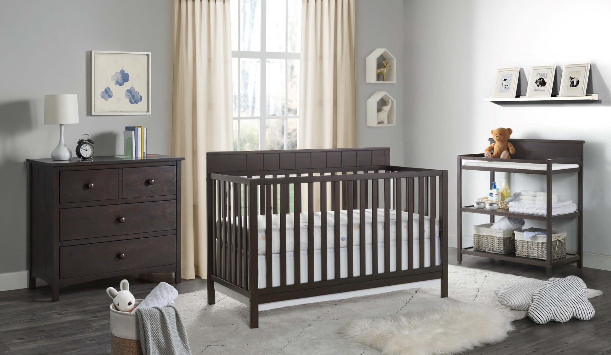 Logan 4-in-1 Convertible Crib - Lifestyle Image Inclined Side View of Logan 4-in-1 Convertible Crib Espresso with 3 Drawer Dresser