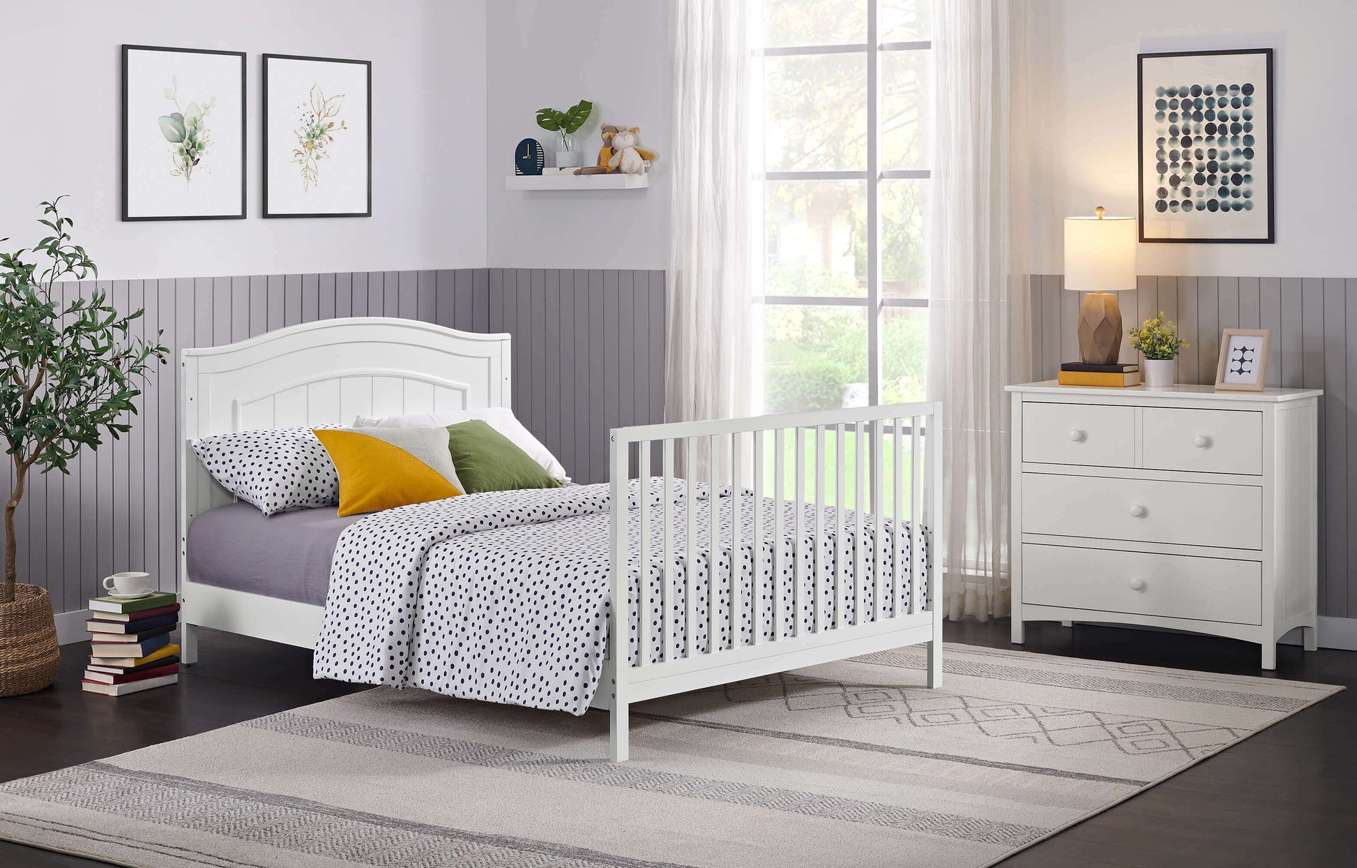 Nolan 4 in 1 Convertible Crib - Lifestyle Image Inclined Side View of Nolan Full Sized Bed Snow White