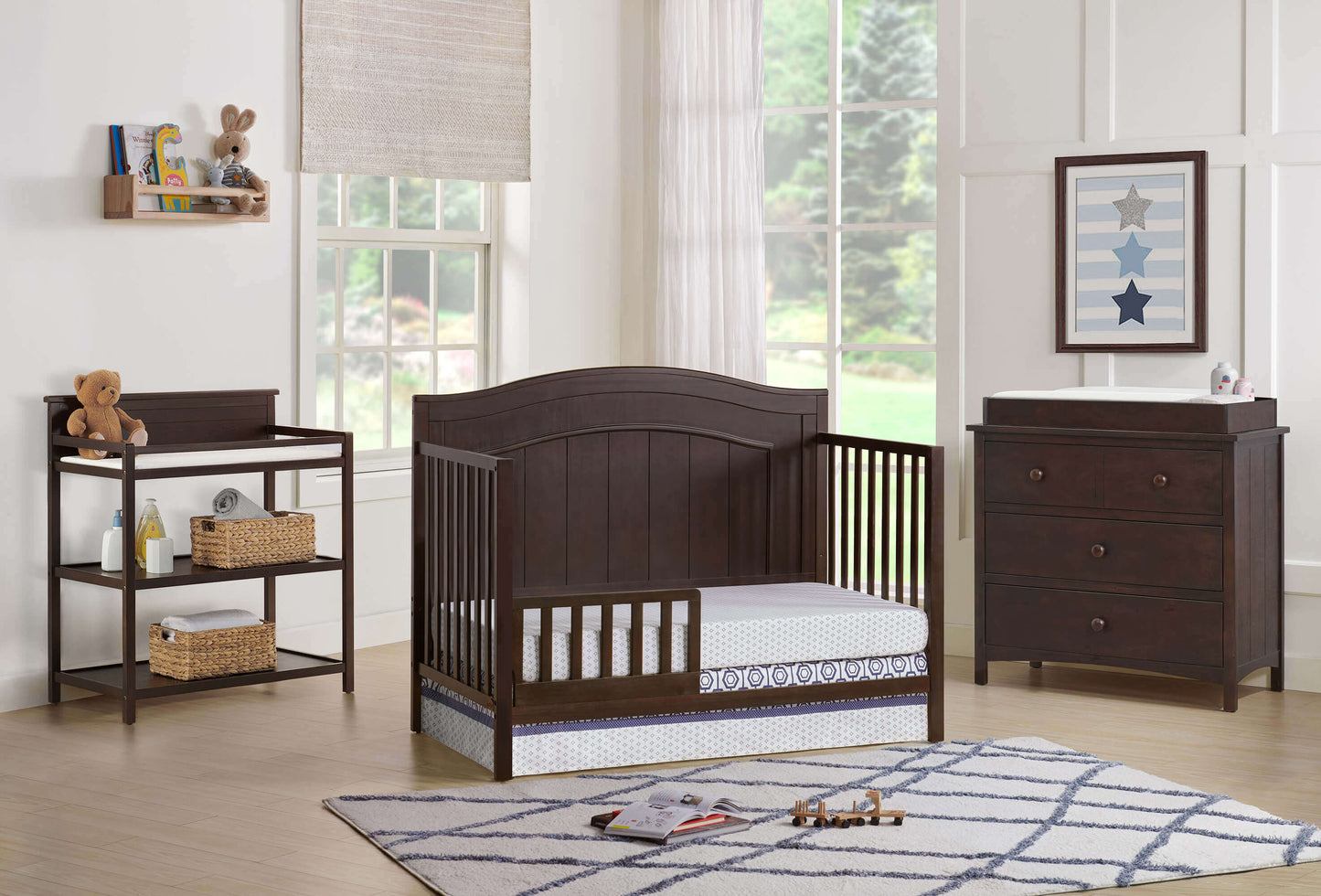 Nolan 4 in 1 Convertible Crib - Lifestyle Image Inclined Side View of Nolan 4 in 1 Convertible Crib Espresso with Guard Rail