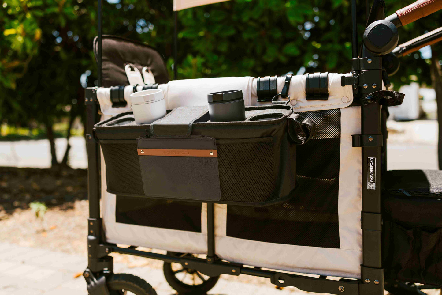 Parent Console with 2 Insulated Cup Holders - Lifestyle Image Zoom View of Parent Console with 2 Insulated Cup Holders Black Hanging on the Side of Wagon