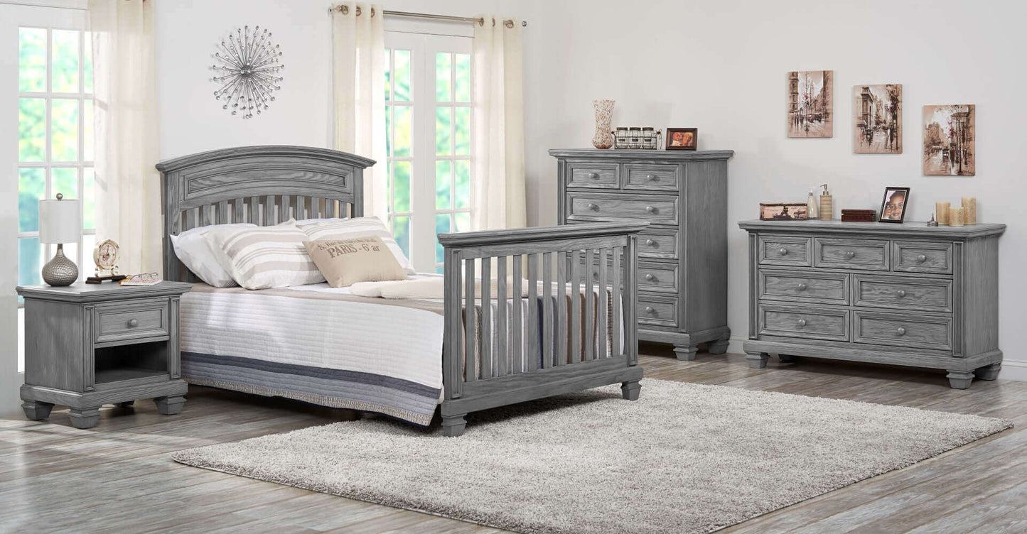 Richmond 7 Drawer Dresser - Lifestyle Image Inclined Side View of Richmond 7 Drawer Dresser Behind Richmond Full Sized Bed Brushed Gray