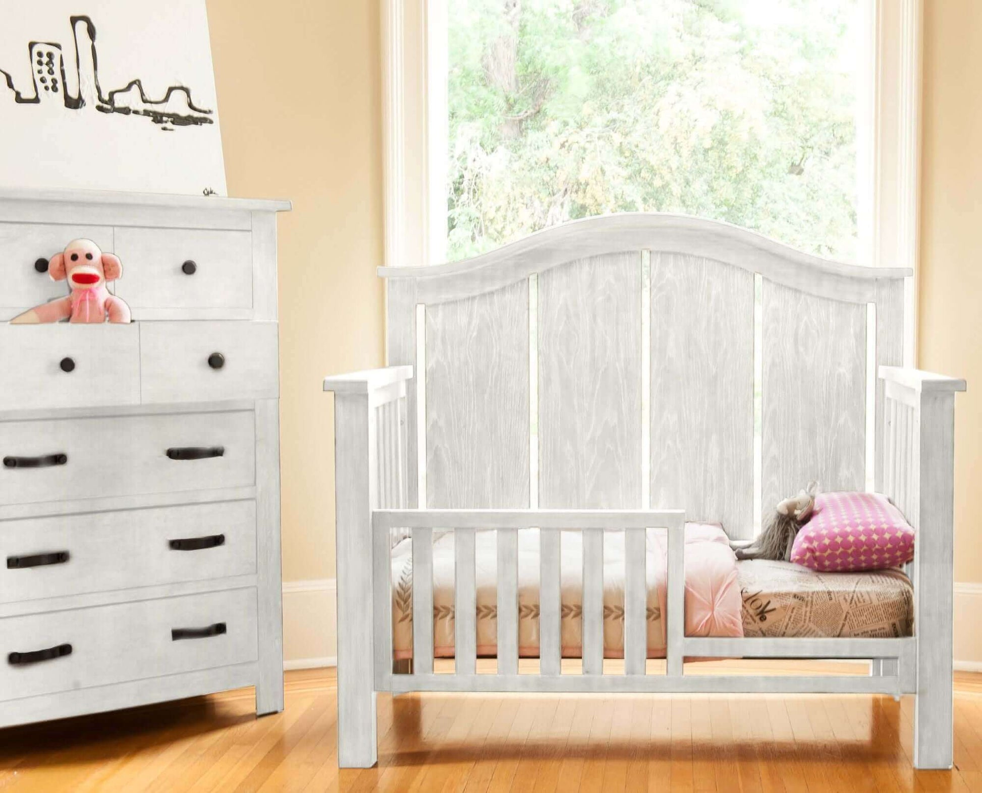 Relic Arch 4-in-1 Convertible Crib - Lifestyle Image of Toddler Bed Conversion Kit Cloud Besides Drawer Dresser