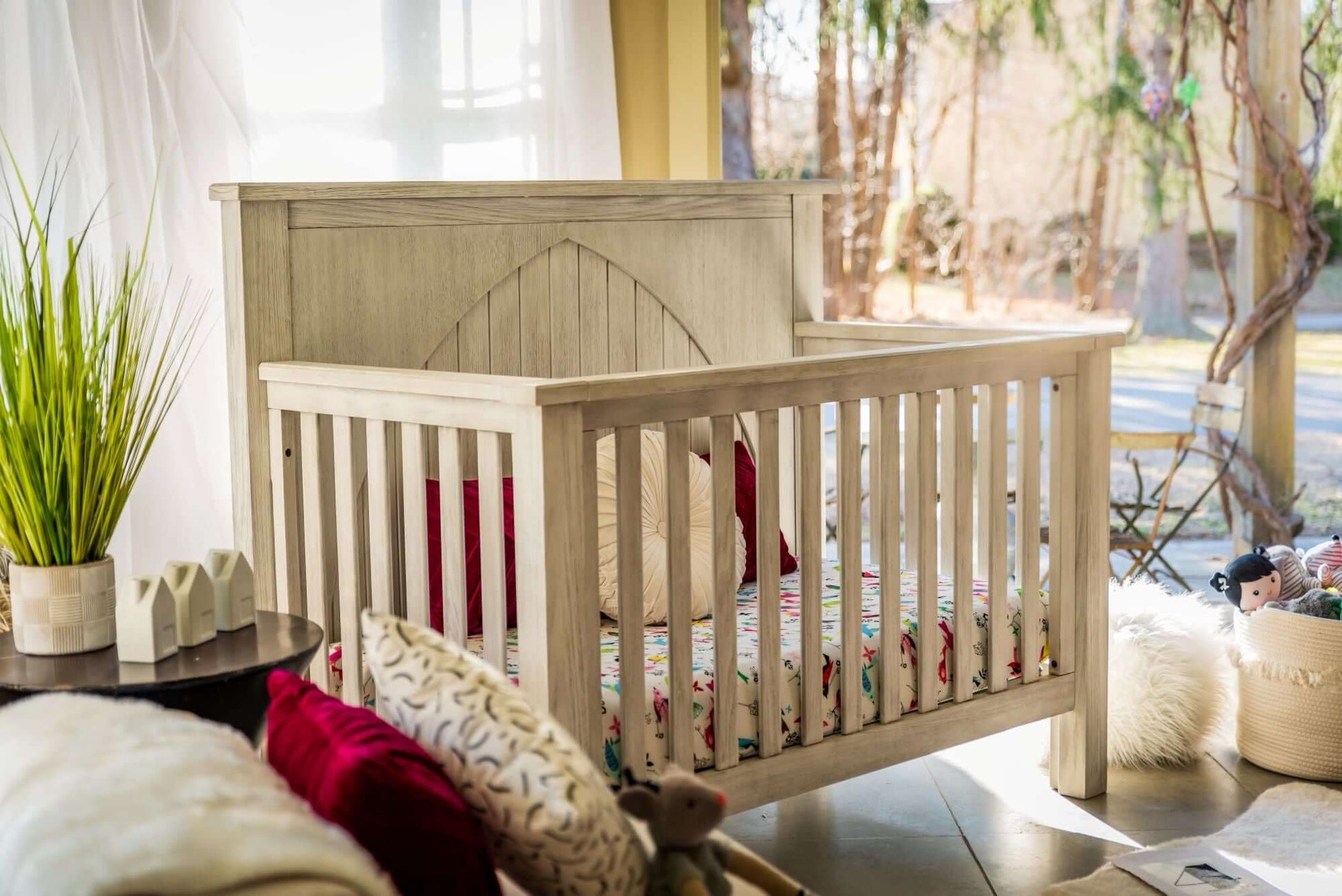Relic Winchester 4-in-1 Convertible Crib - Lifestyle Image Side View of Winchester 4-in-1 Convertible Crib  Fossil