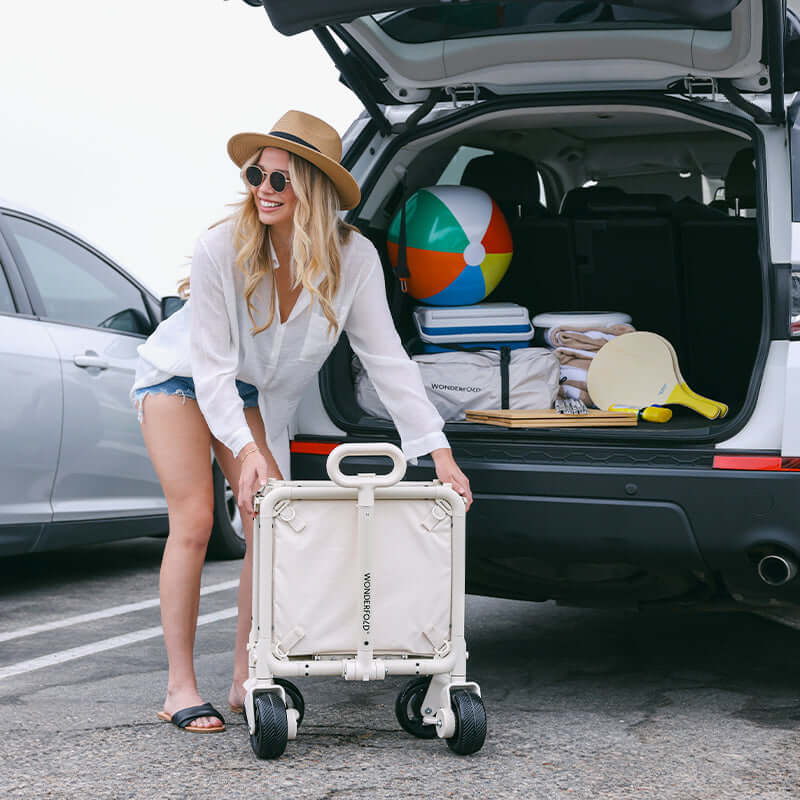 S5 Convertible Utility Wagon - Lifestyle Image of Woman Carrying S5 Convertible Utility Wagon Beige