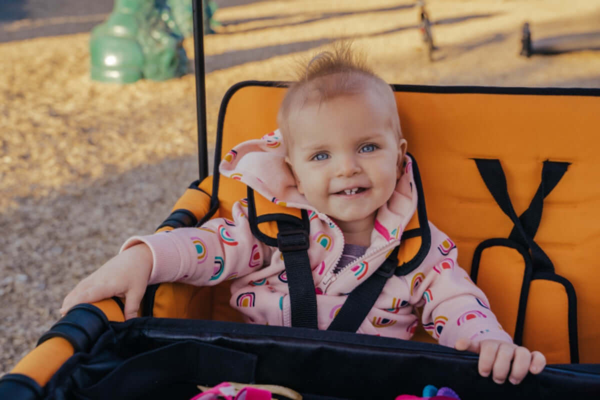 W4 Original Quad Stroller Wagon - Lifestyle Image View Wagon Orange