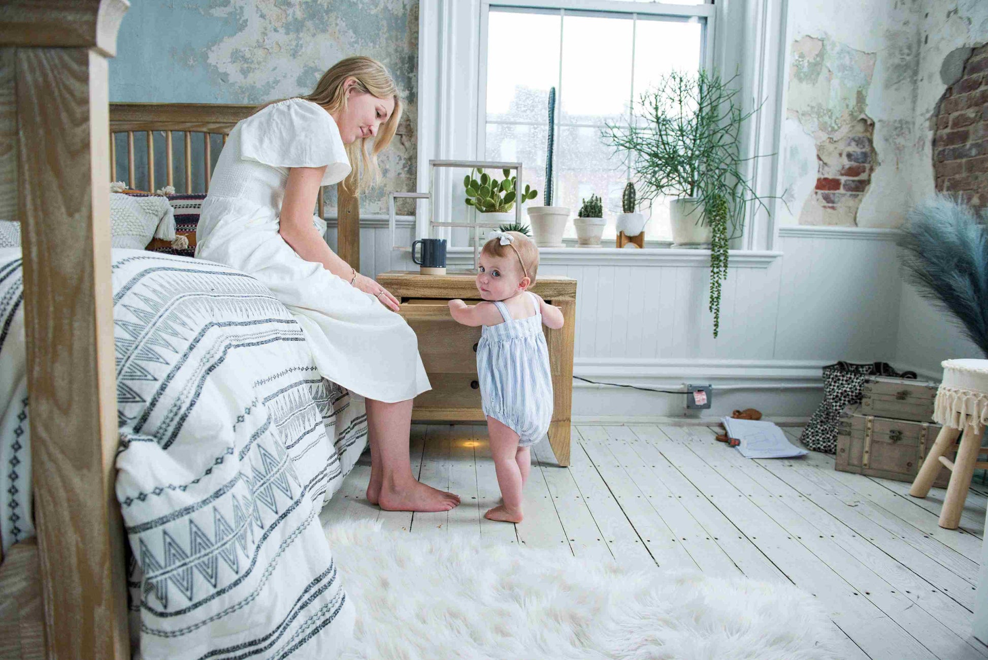 Cameo Oval Convertible Crib -  Zoomed Lifestyle Image Front View of Oval Toddler Bed Steam with Mother and Child