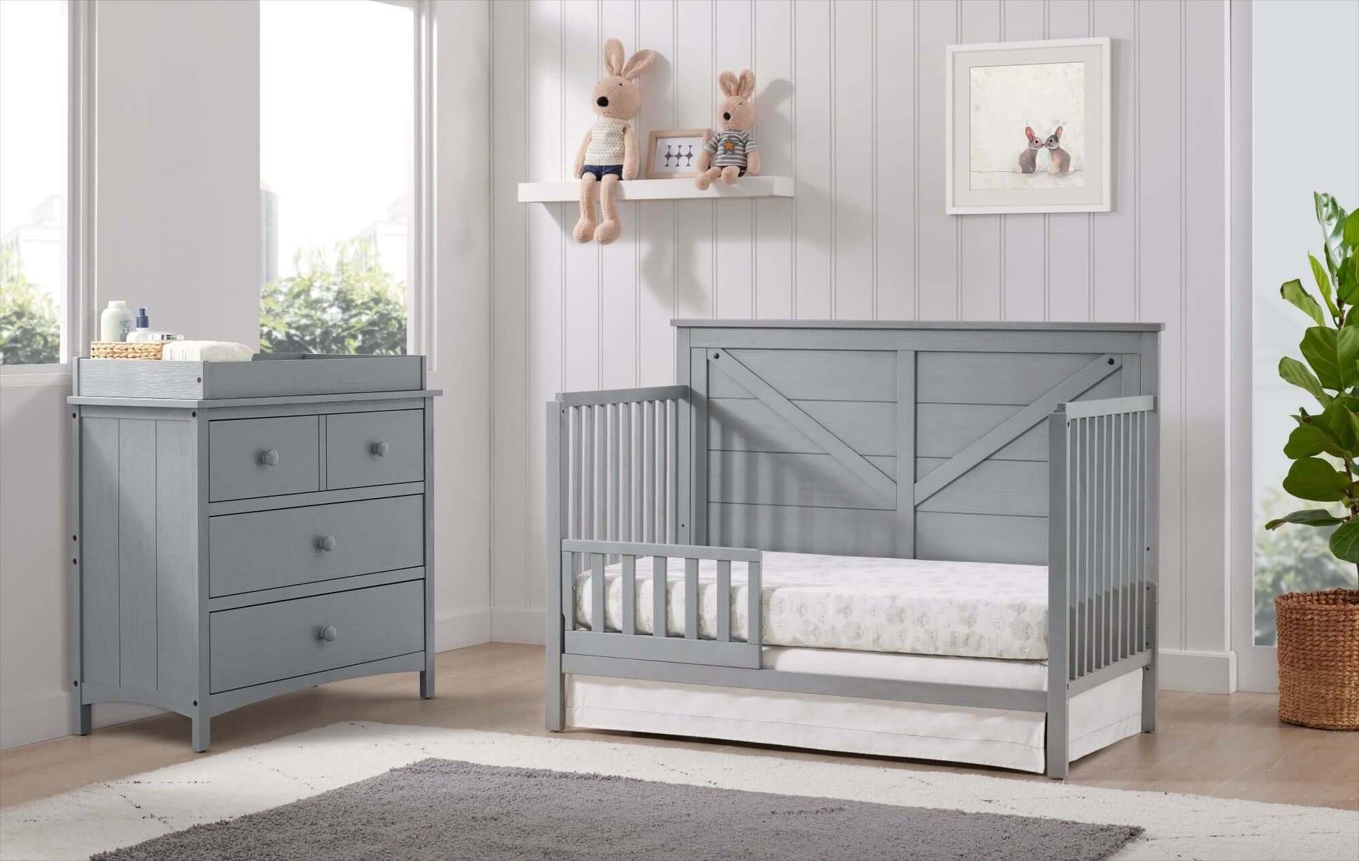 Montauk 3 Drawer Dresser- RTA - Lifestyle Image Inclined Side View of Montauk 3 Drawer Dresser with Montauk Crib Farmhouse Gray