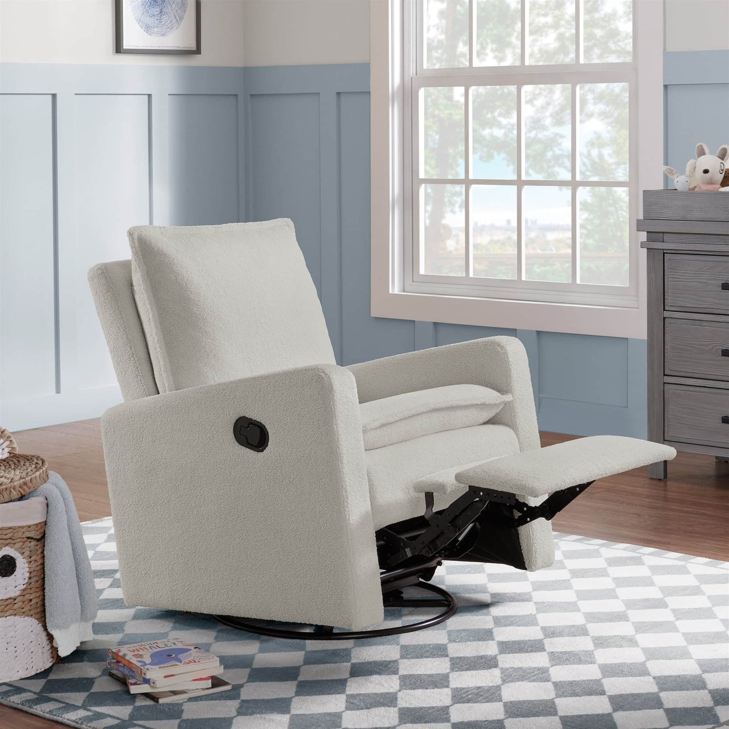 Uptown Nursery Swivel Rocker and Recliner - Lifestyle Image Inclined Side View of Uptown Nursery Swivel Rocker and Recliner Bounce White with Plush rocker