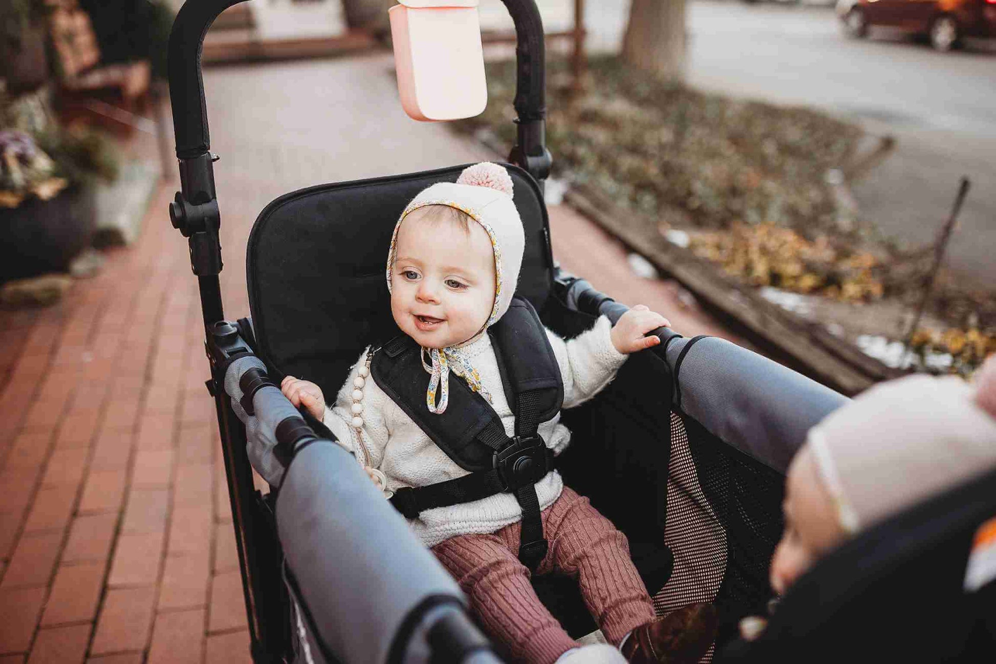W2 Original + Double Stroller Wagon - Lifestyle Image Zoomed View of Toddler on W2 Original + Double Stroller Wagon Gray