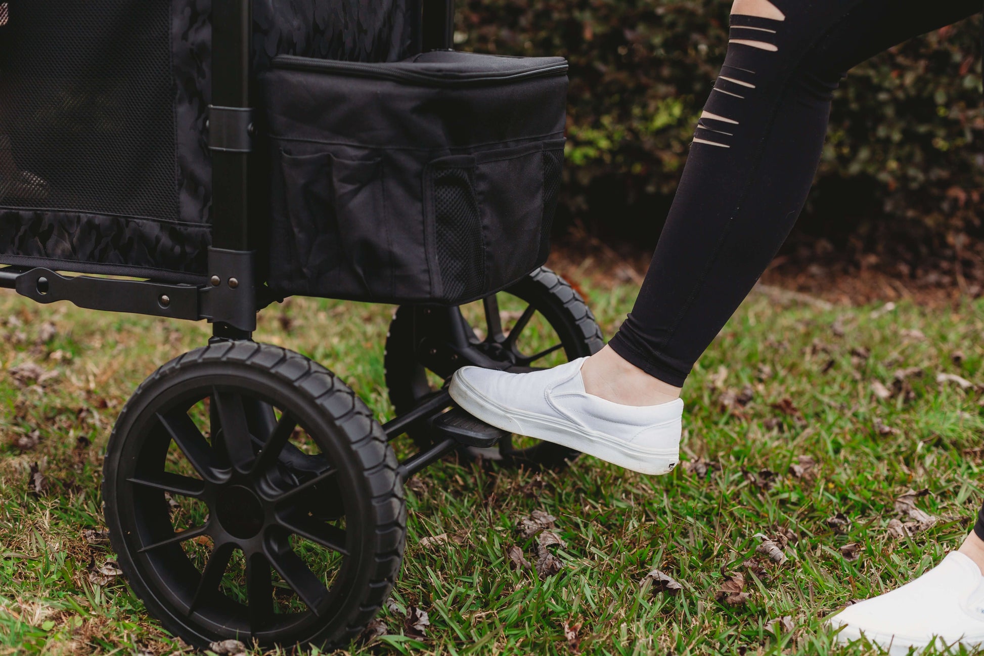 W2 Luxe Double Stroller Wagon - Lifestyle Image of Brakes in usage of W2 Luxe Double Stroller Wagon Black