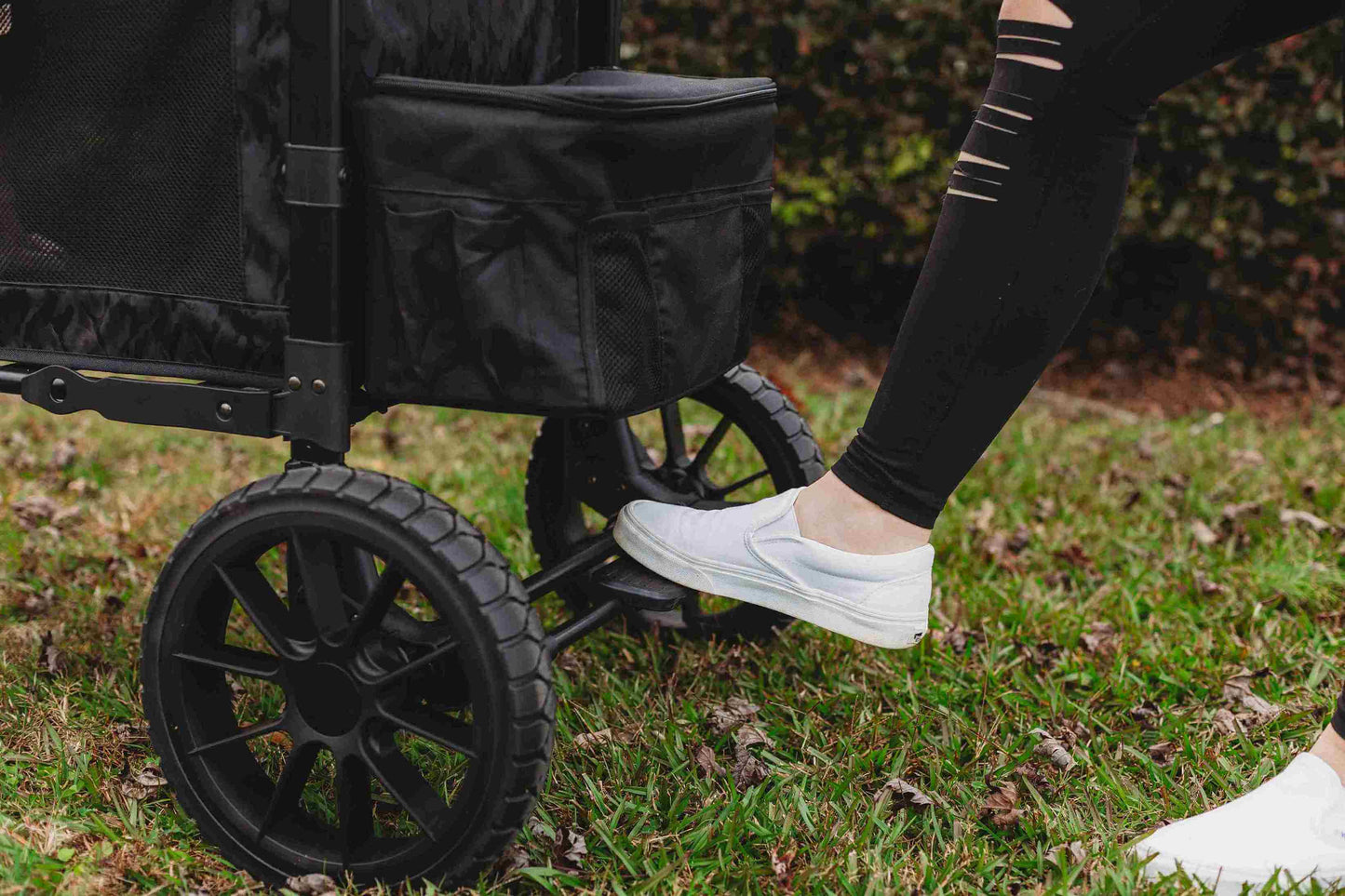W2 Luxe Double Stroller Wagon - Lifestyle Image of Brakes in usage of W2 Luxe Double Stroller Wagon Black