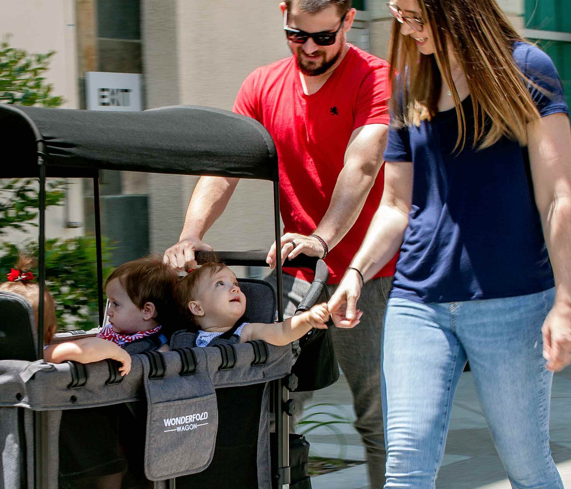 W4 Original Quad Stroller Wagon - Lifestyle Image Sitting Baby Wagon Gray